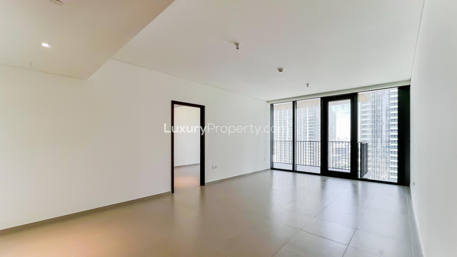 Alt text: "Balcony view of Downtown Dubai skyline from BLVD Heights apartment for rent.",Spacious living room in two-bedroom apartment with Boulevard view, BLVD Heights, Downtown Dubai