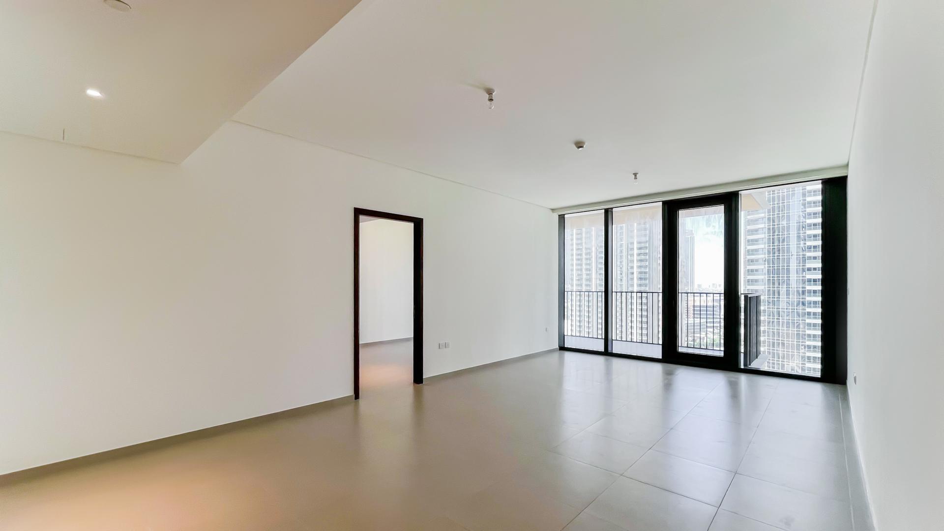 Alt text: "Balcony view of Downtown Dubai skyline from BLVD Heights apartment for rent.",Spacious living room in two-bedroom apartment with Boulevard view, BLVD Heights, Downtown Dubai