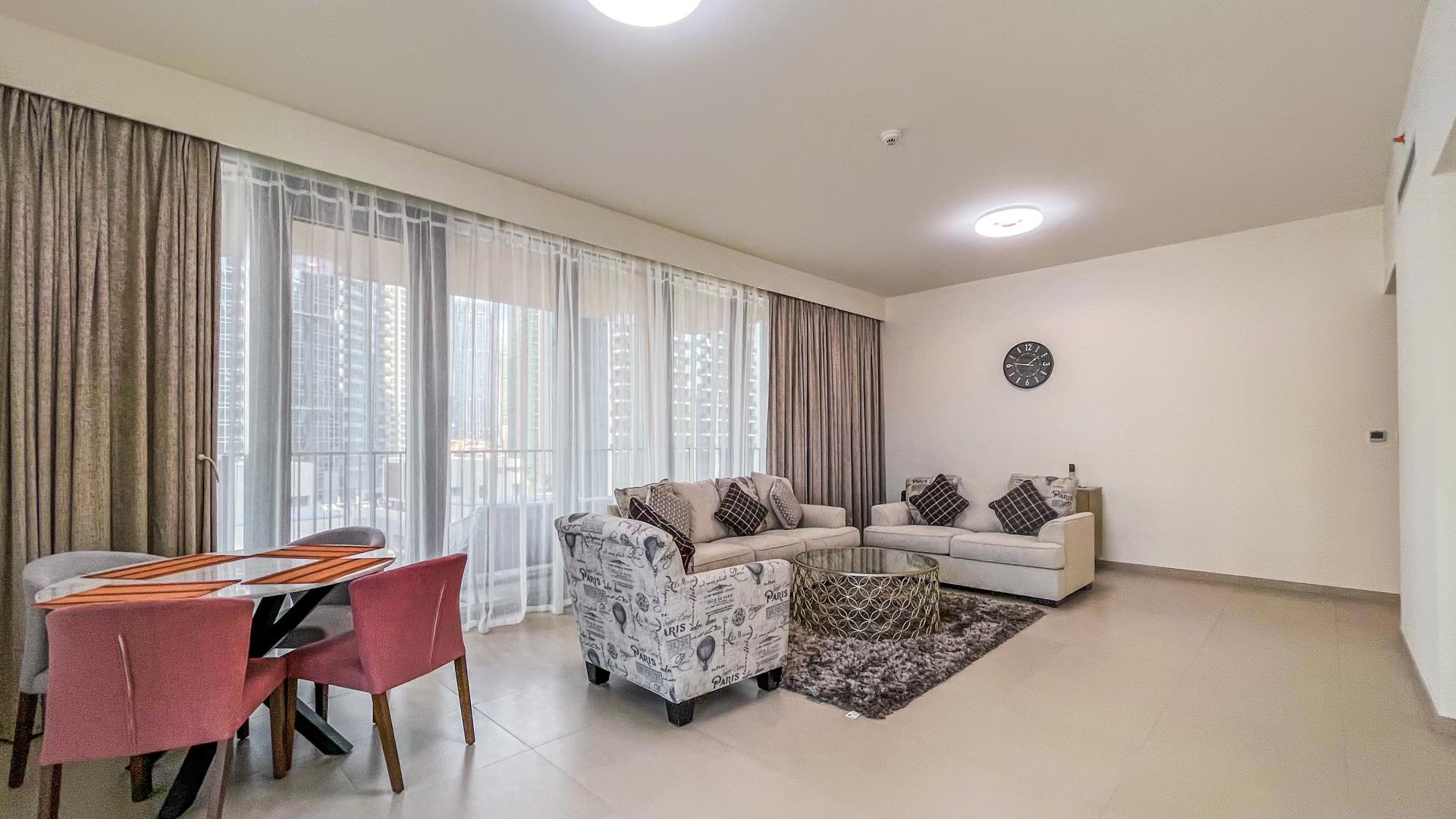 Fully furnished Downtown Dubai apartment living room with balcony and city views