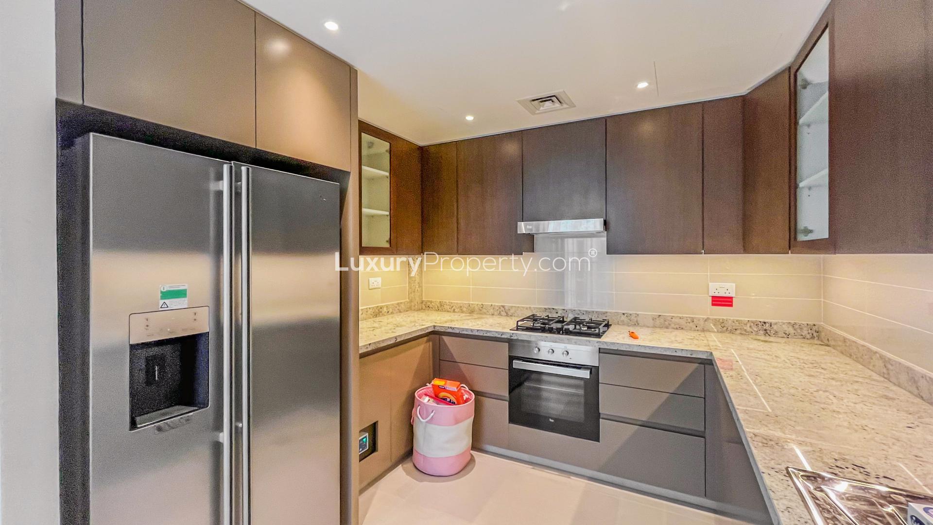 Fully furnished living room in Downtown Dubai apartment with modern decor and city views