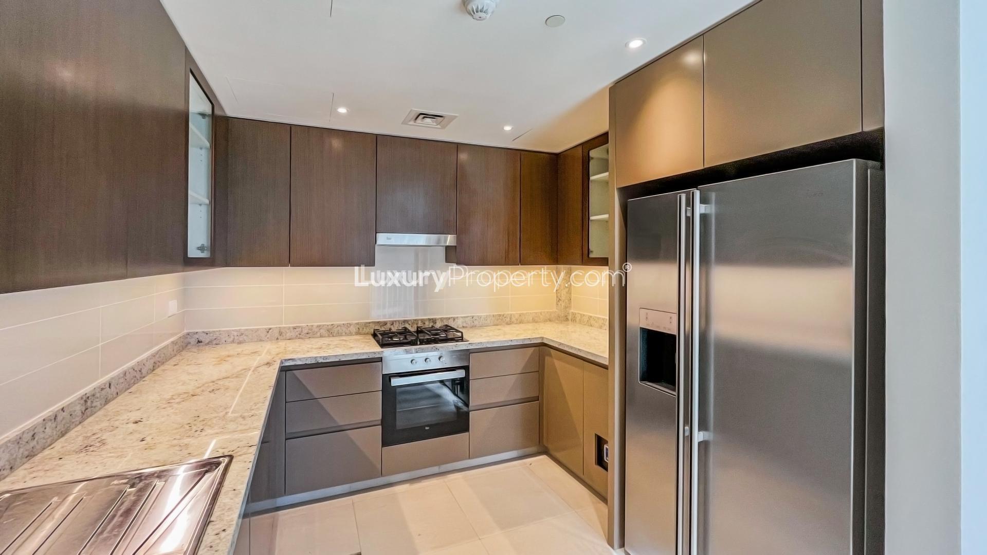 Modern kitchen in 2-bedroom apartment, BLVD Heights, Downtown Dubai, with sleek cabinets and appliances