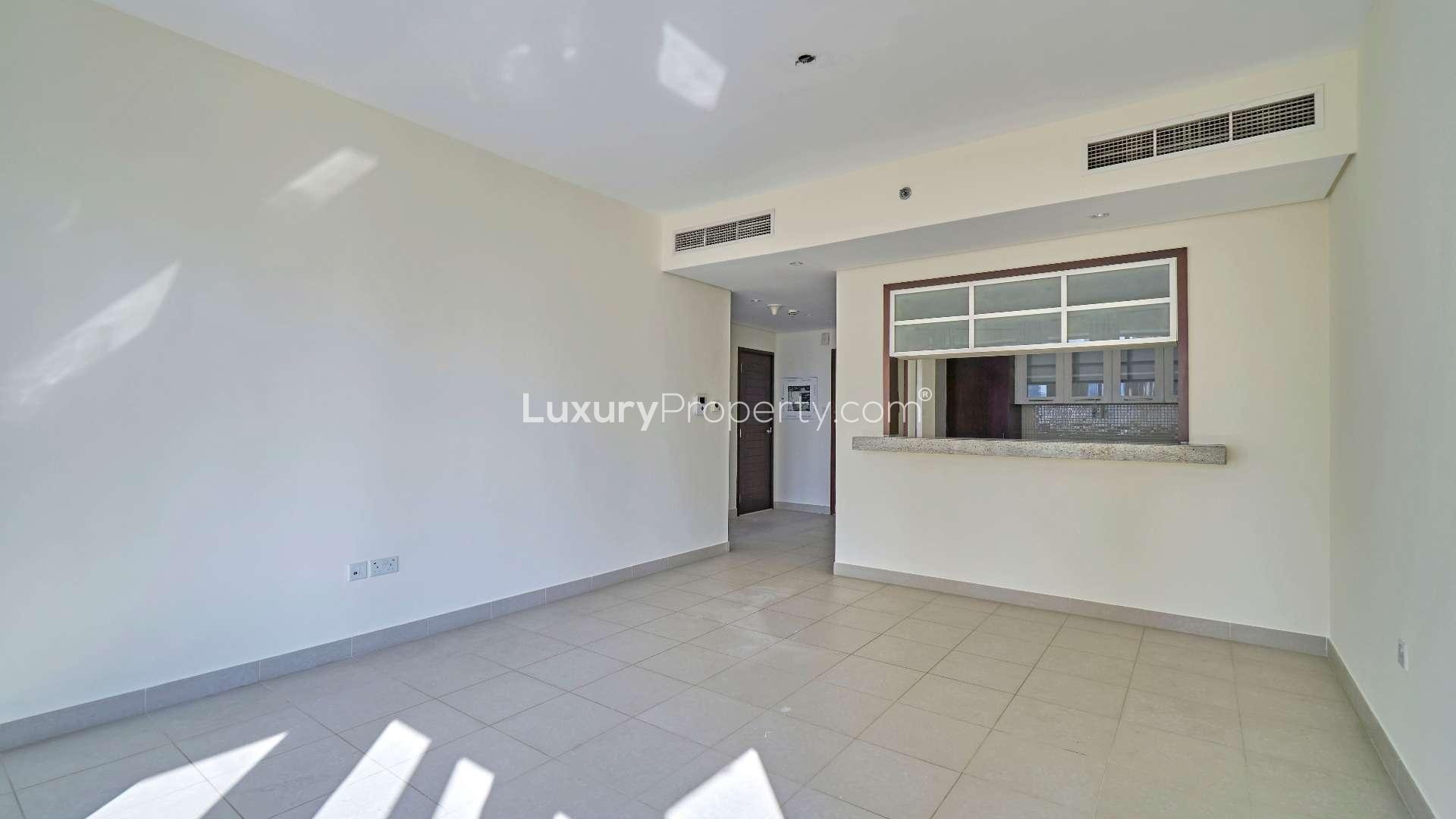 Modern apartment living room with large windows and city view in Downtown Dubai