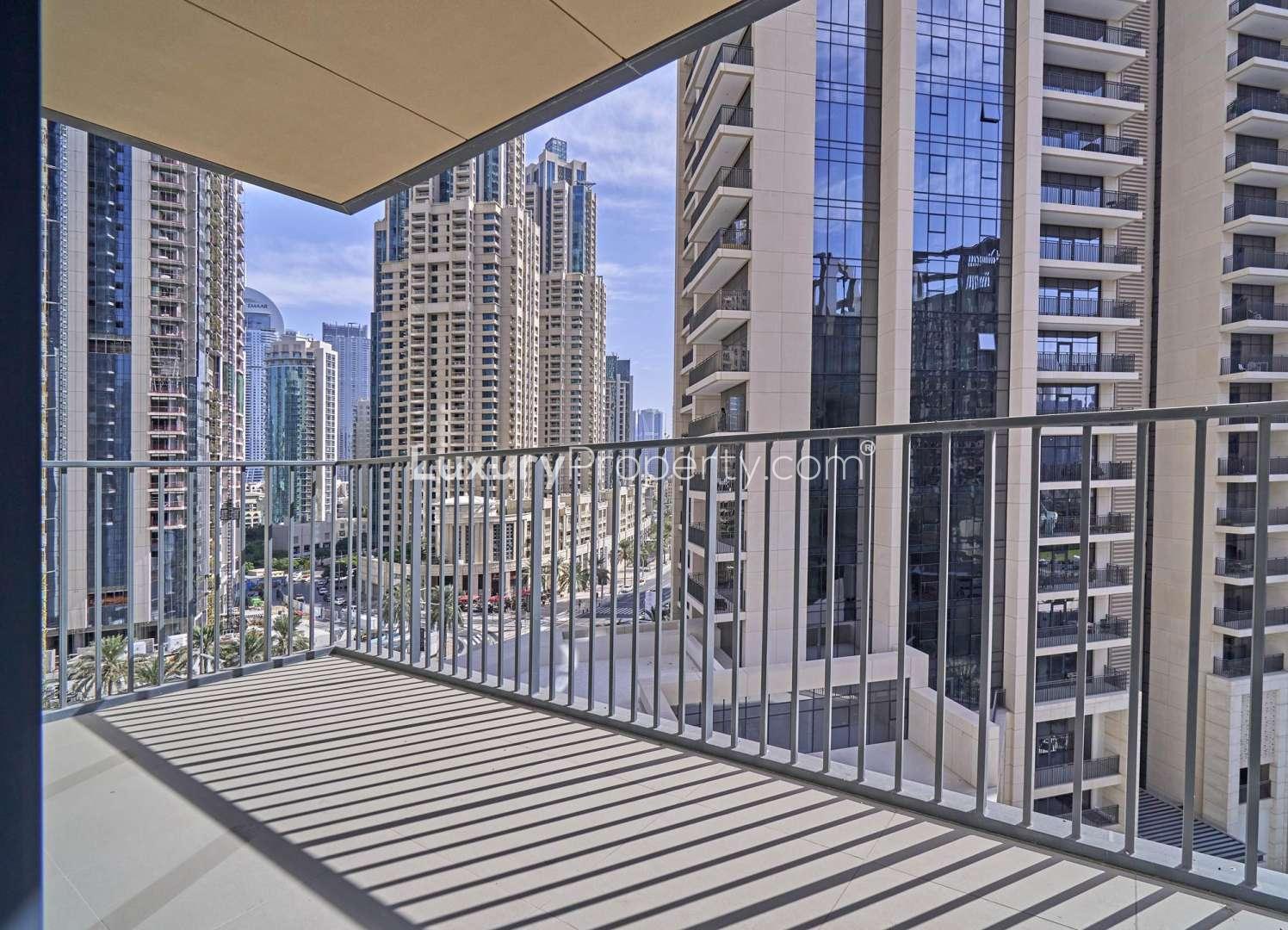 Spacious living room with floor-to-ceiling windows in Downtown Dubai apartment for rent
