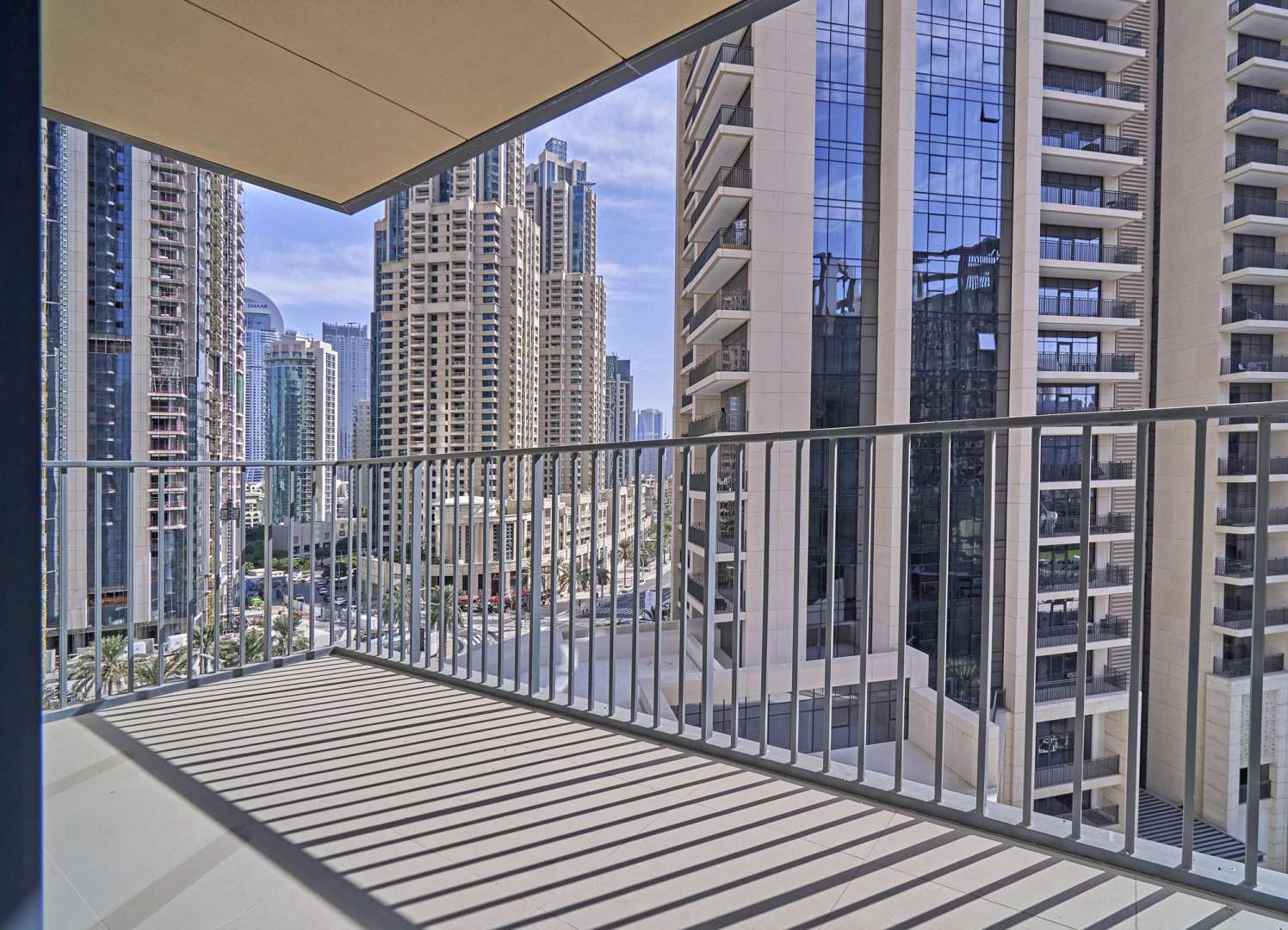 Spacious living room with floor-to-ceiling windows in Downtown Dubai apartment for rent