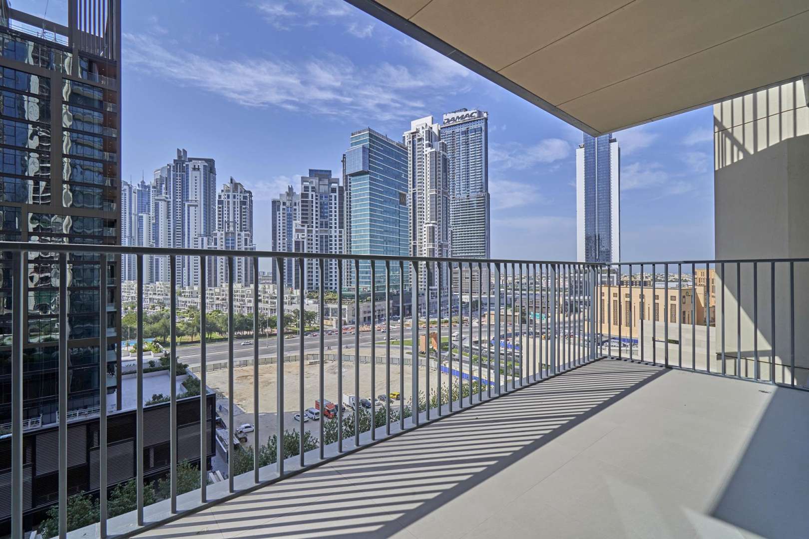 Balcony view from apartment in BLVD Heights, Downtown Dubai, showcasing city skyscrapers