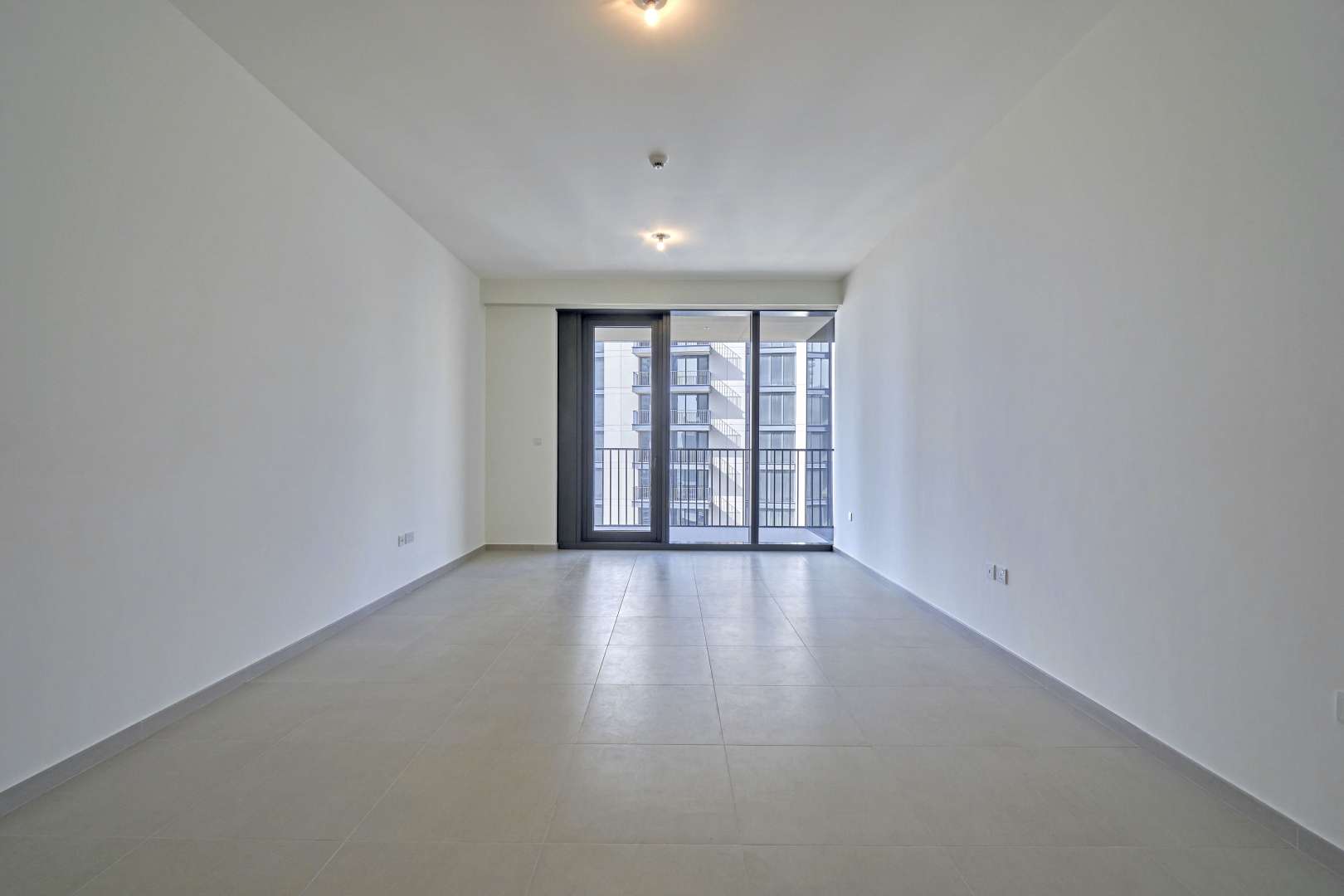 Elegant living room with large windows in Downtown Dubai apartment for rent