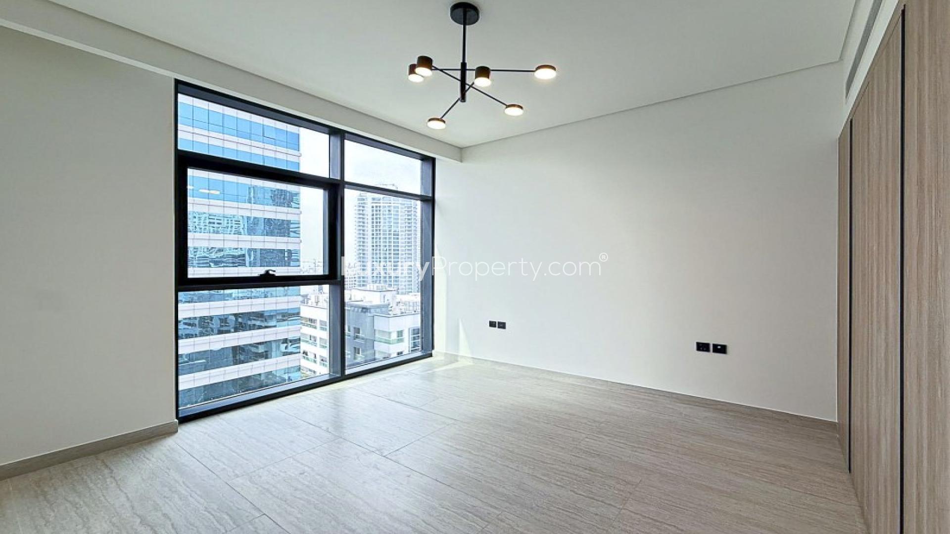 Dubai Marina apartment view with high-rise buildings and roundabout in Marina Living