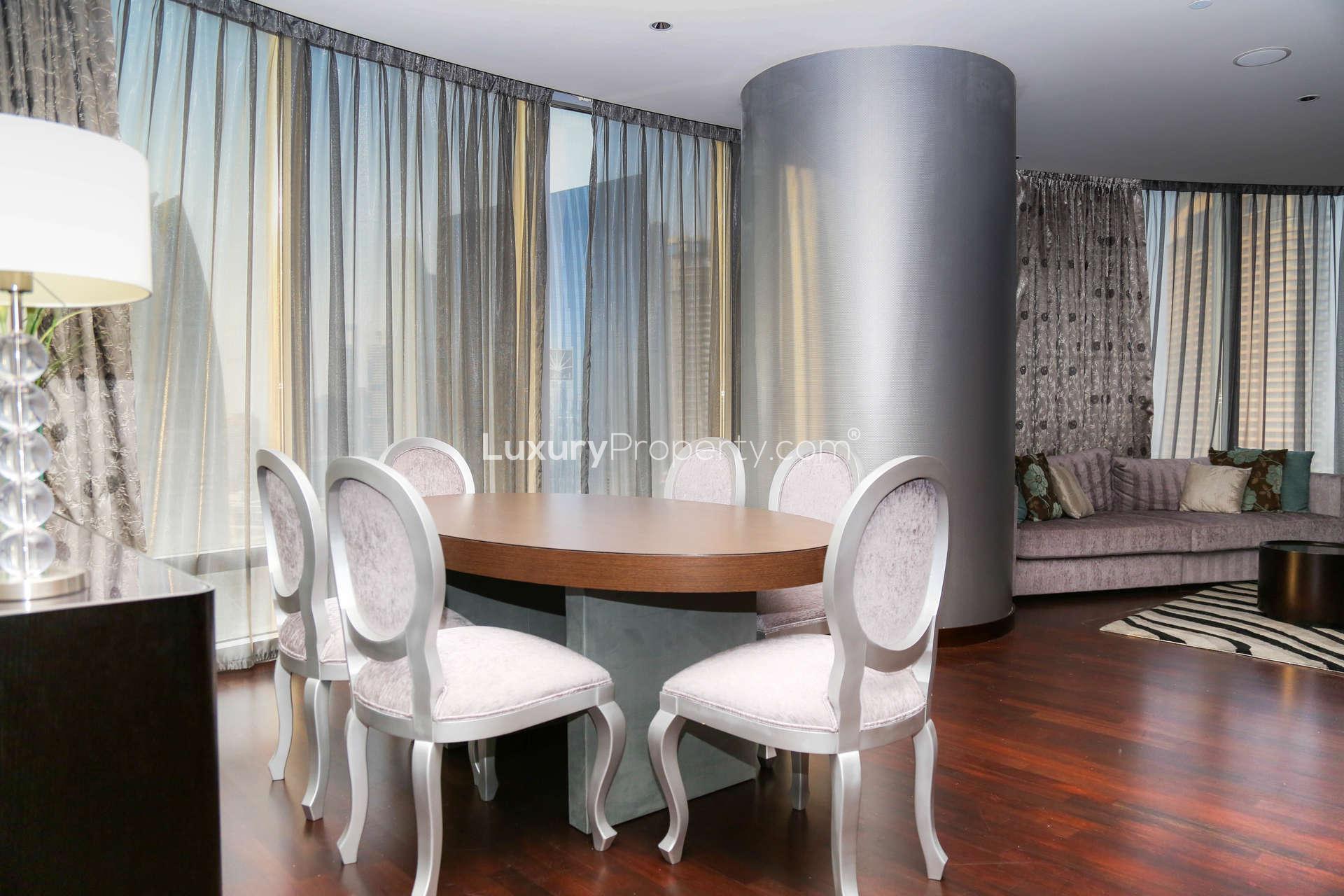 Luxury dining area in 2-bedroom apartment, Burj Khalifa, Downtown Dubai. Elegant decor and lighting