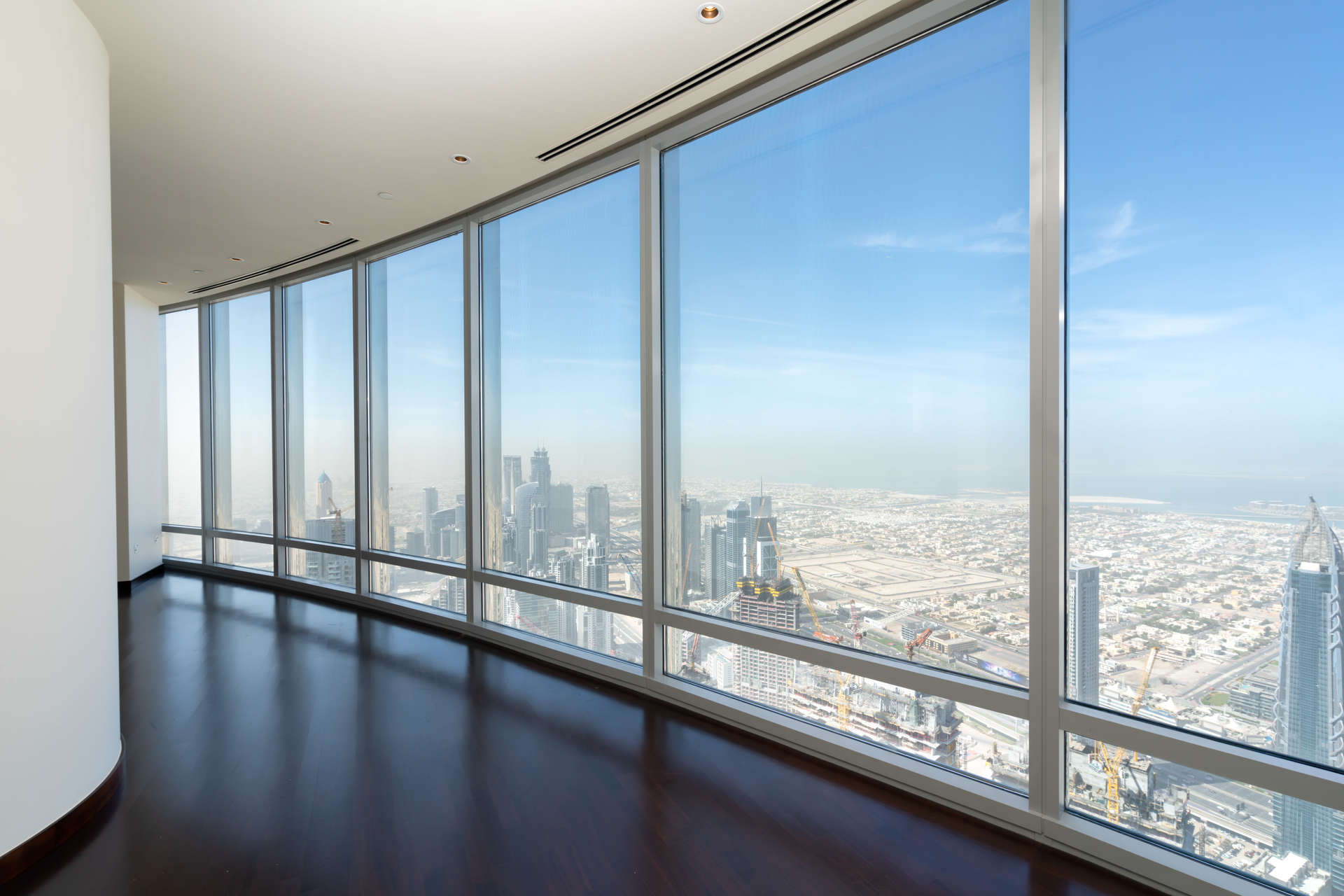 Light-filled apartment interior with stunning downtown Dubai skyline view, Burj Khalifa residence