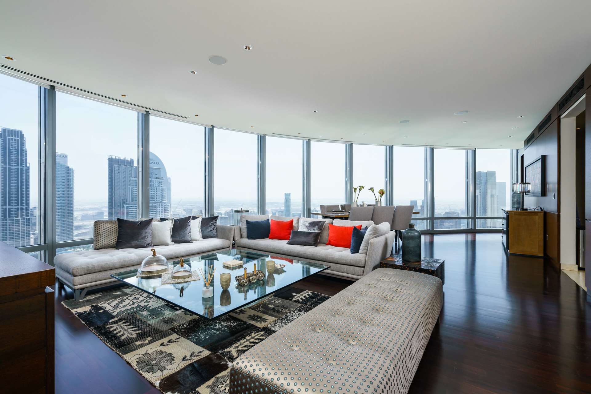 Furnished apartment living room with floor-to-ceiling windows and stunning Downtown Dubai views