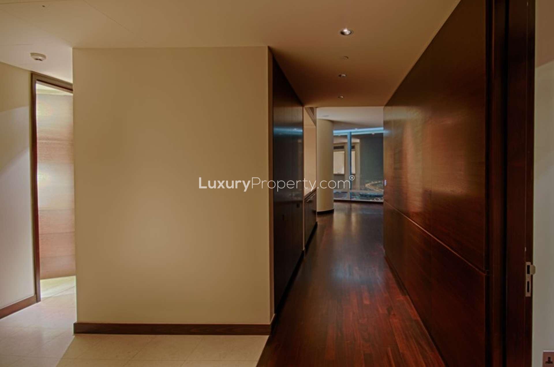Empty room with wooden flooring in Burj Khalifa apartment, Downtown Dubai, for rent