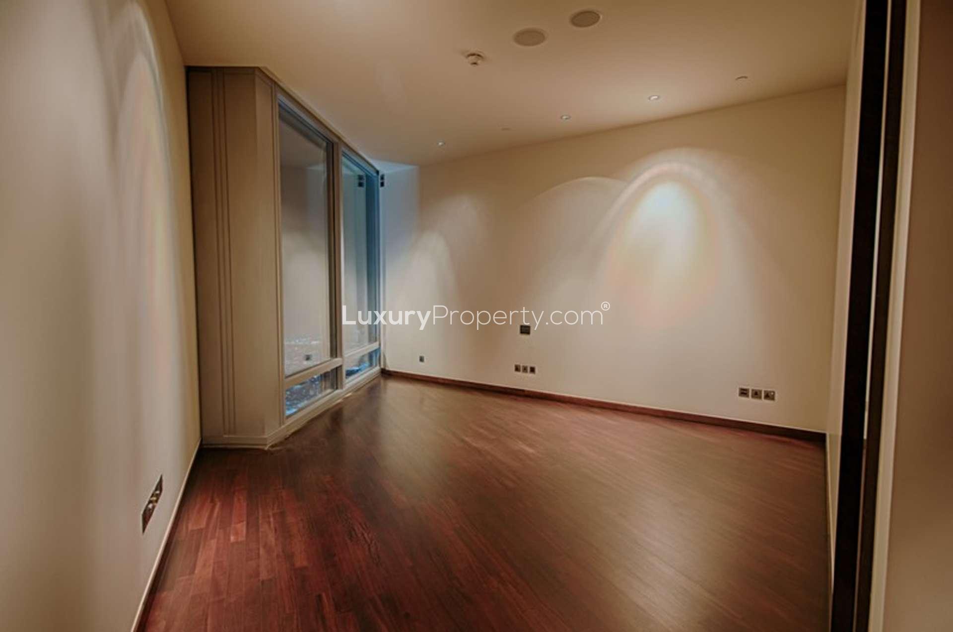 Empty bedroom with wooden flooring in Burj Khalifa apartment, Downtown Dubai rental