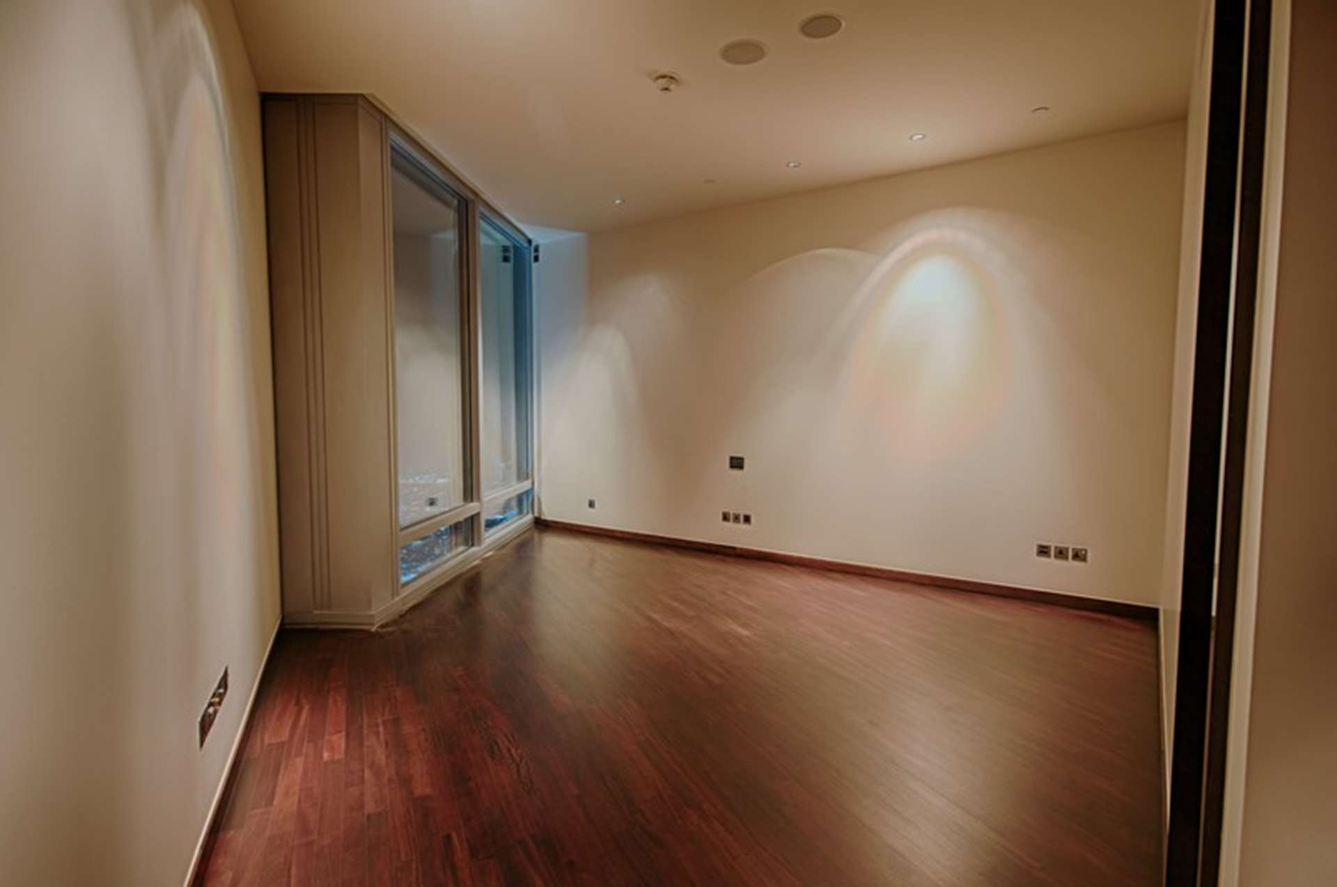 Empty bedroom with wooden flooring in Burj Khalifa apartment, Downtown Dubai rental