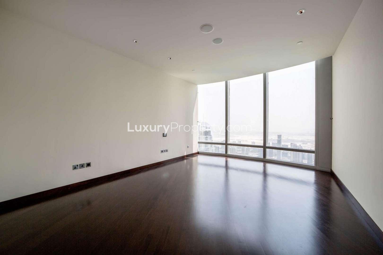 Modern bathroom in high-floor apartment, Downtown Dubai, featuring dual sinks and a bathtub