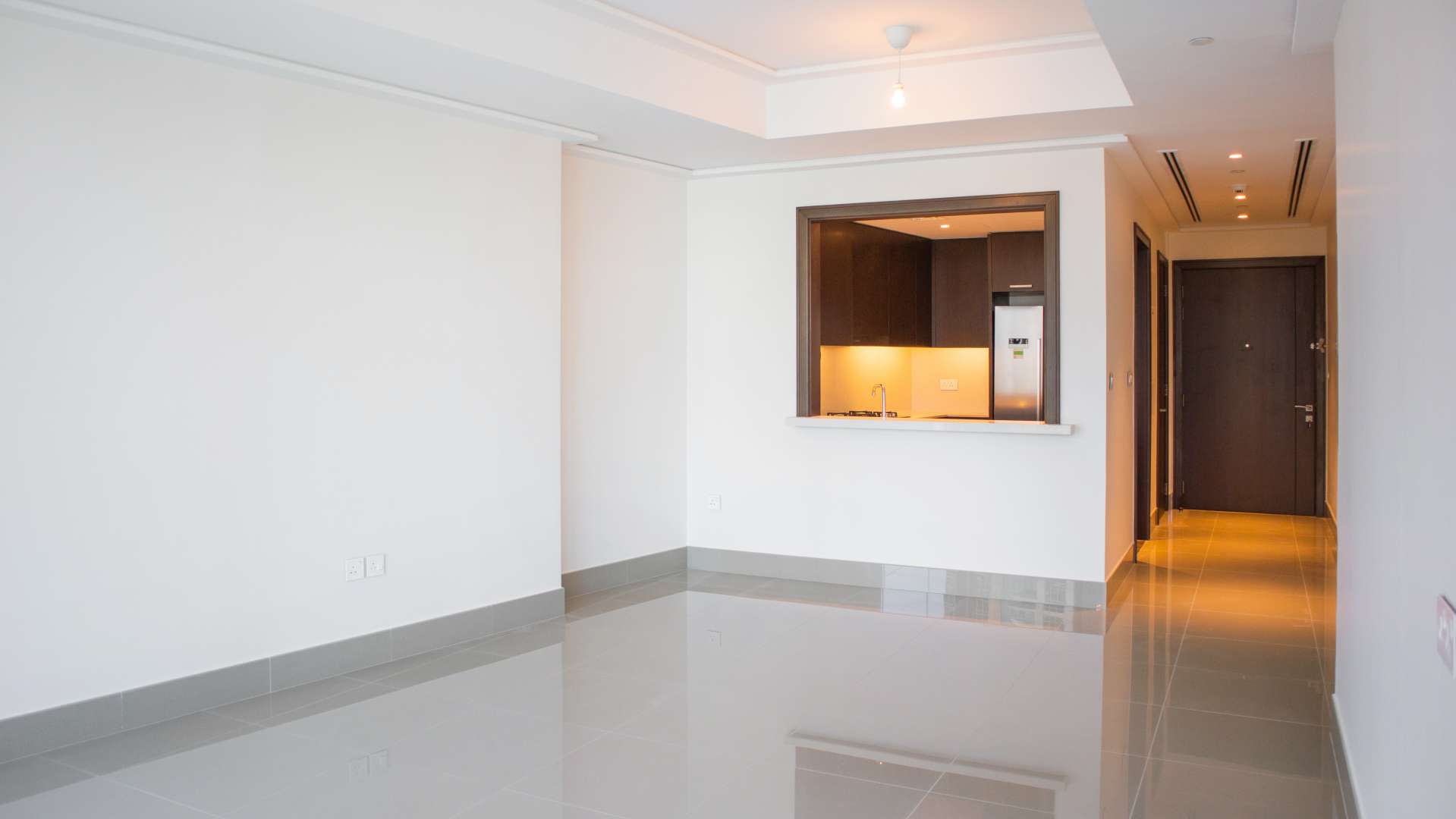 "Spacious Downtown Dubai apartment with modern kitchen, bright living area, LP11560 for rent.",Front-load washing machine in Downtown Dubai apartment laundry area