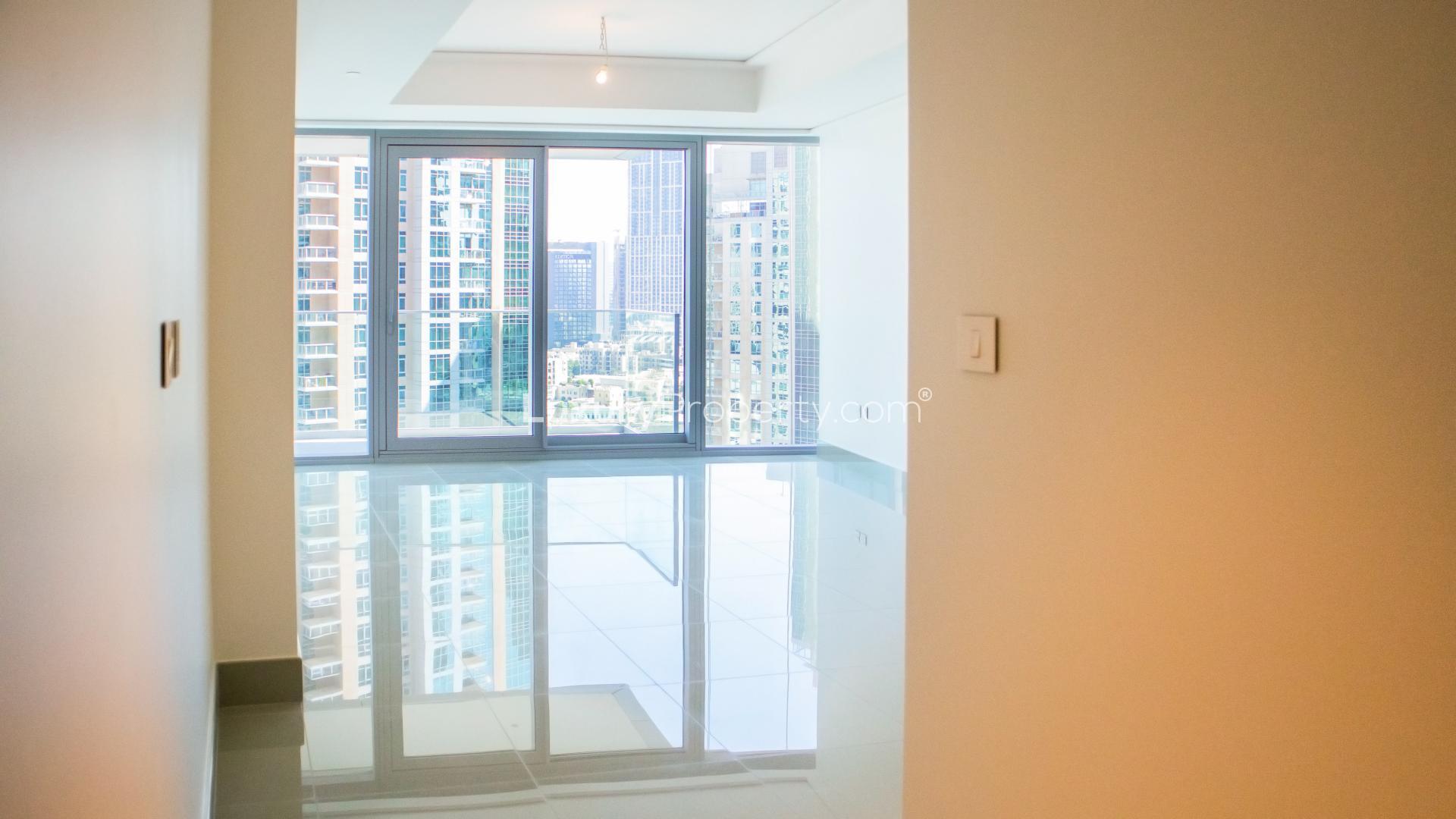 Modern kitchen in Opera Grand apartment, Downtown Dubai, featuring sleek cabinets and stainless steel appliances