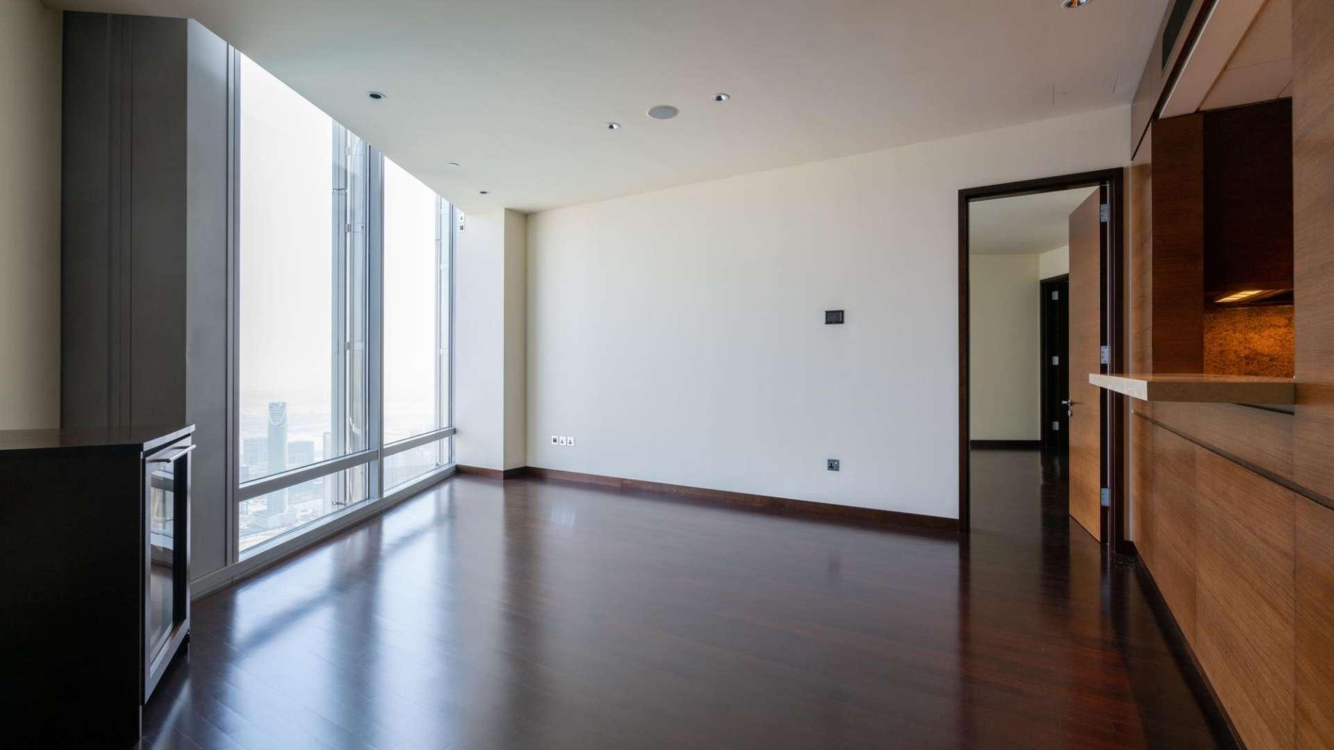 Empty apartment interior with large windows in Burj Khalifa Area, Downtown Dubai