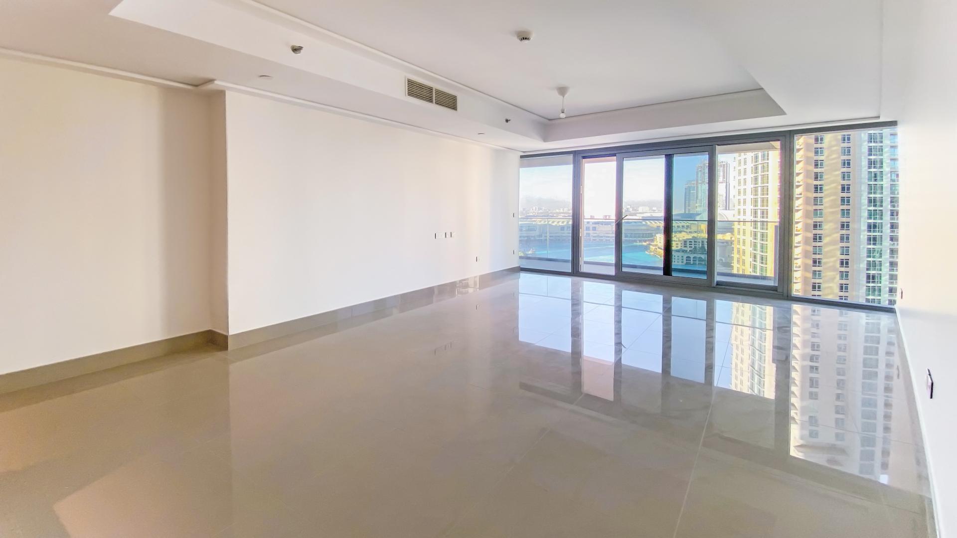 Spacious apartment interior with large windows in Downtown Dubai, Burj Khalifa view