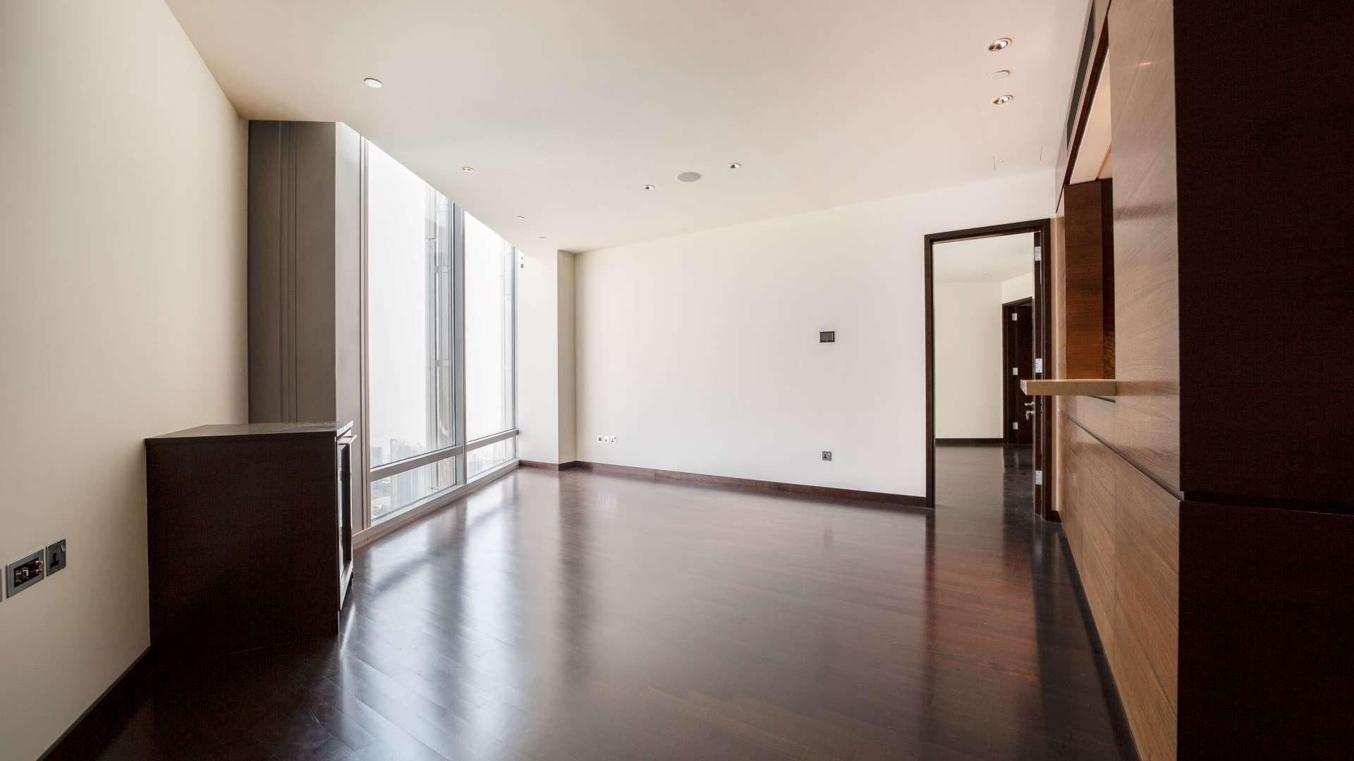 Luxurious apartment interior with hardwood floors and large windows in Burj Khalifa, Downtown Dubai