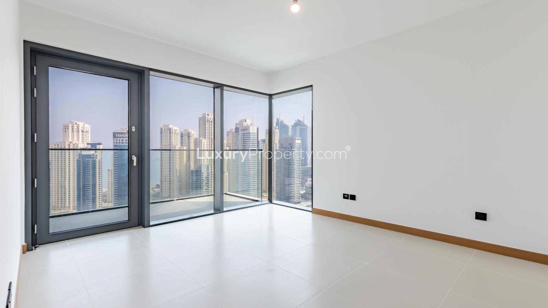Aerial view of Dubai Marina skyline and yachts from Vida Residence apartment balcony