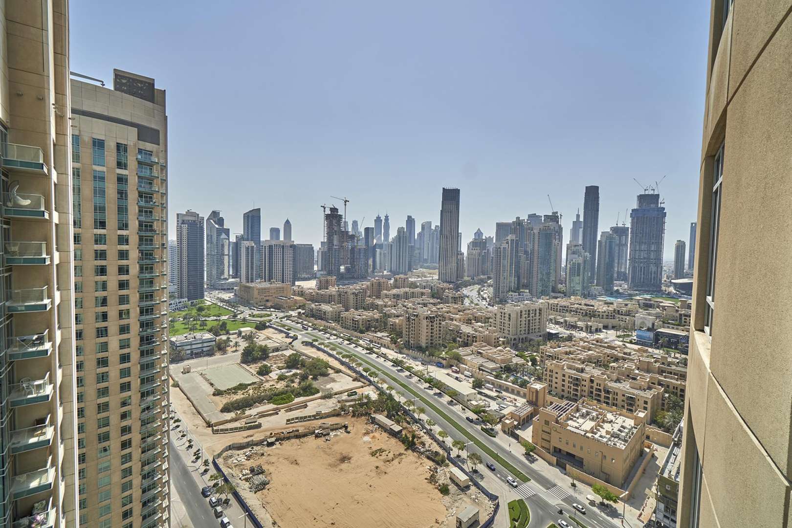 Bright living room with large windows in Burj Views Tower C apartment, Downtown Dubai