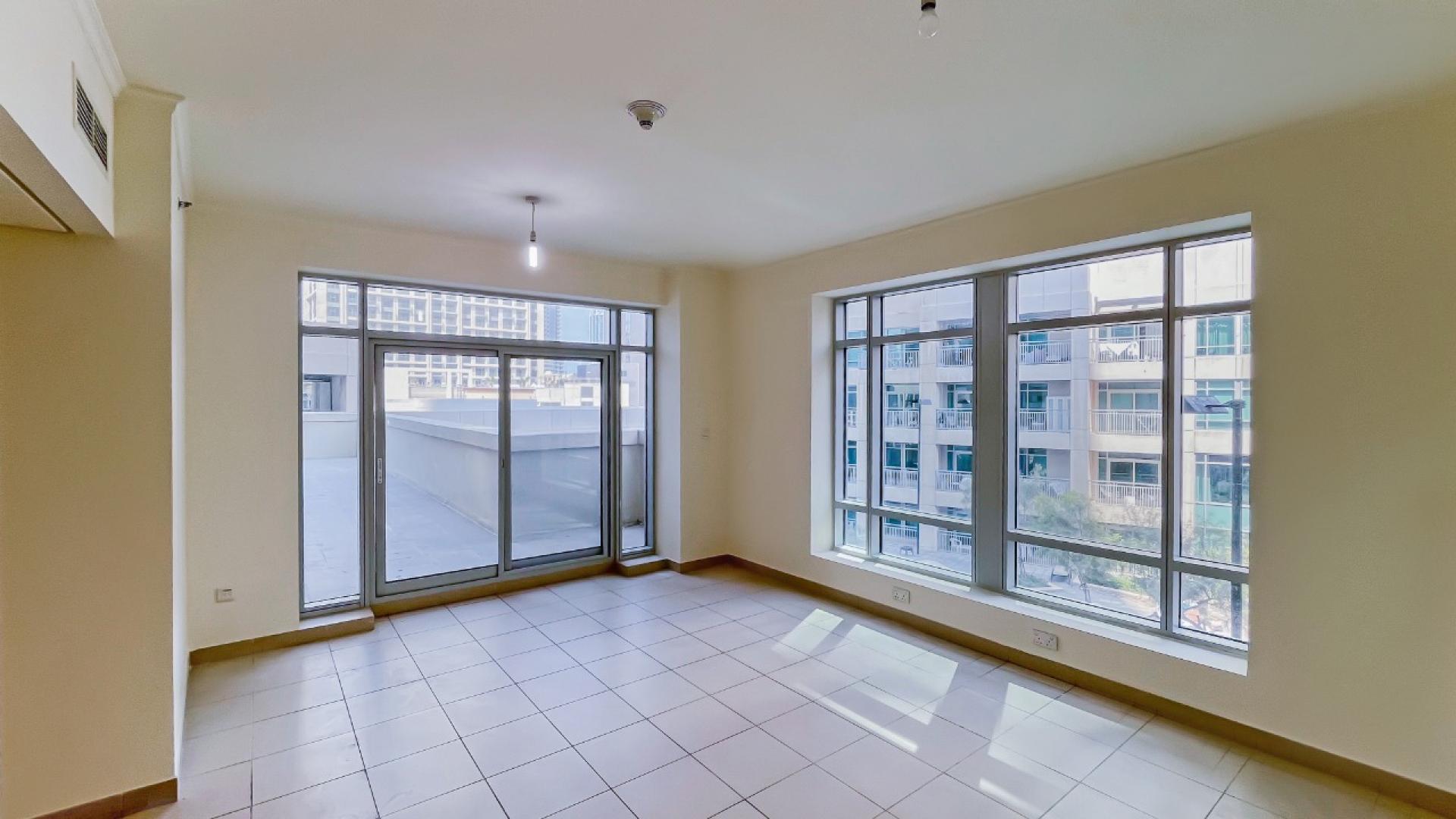 Modern kitchen in two-bedroom apartment, Burj Views, Downtown Dubai. Spacious layout, granite countertops