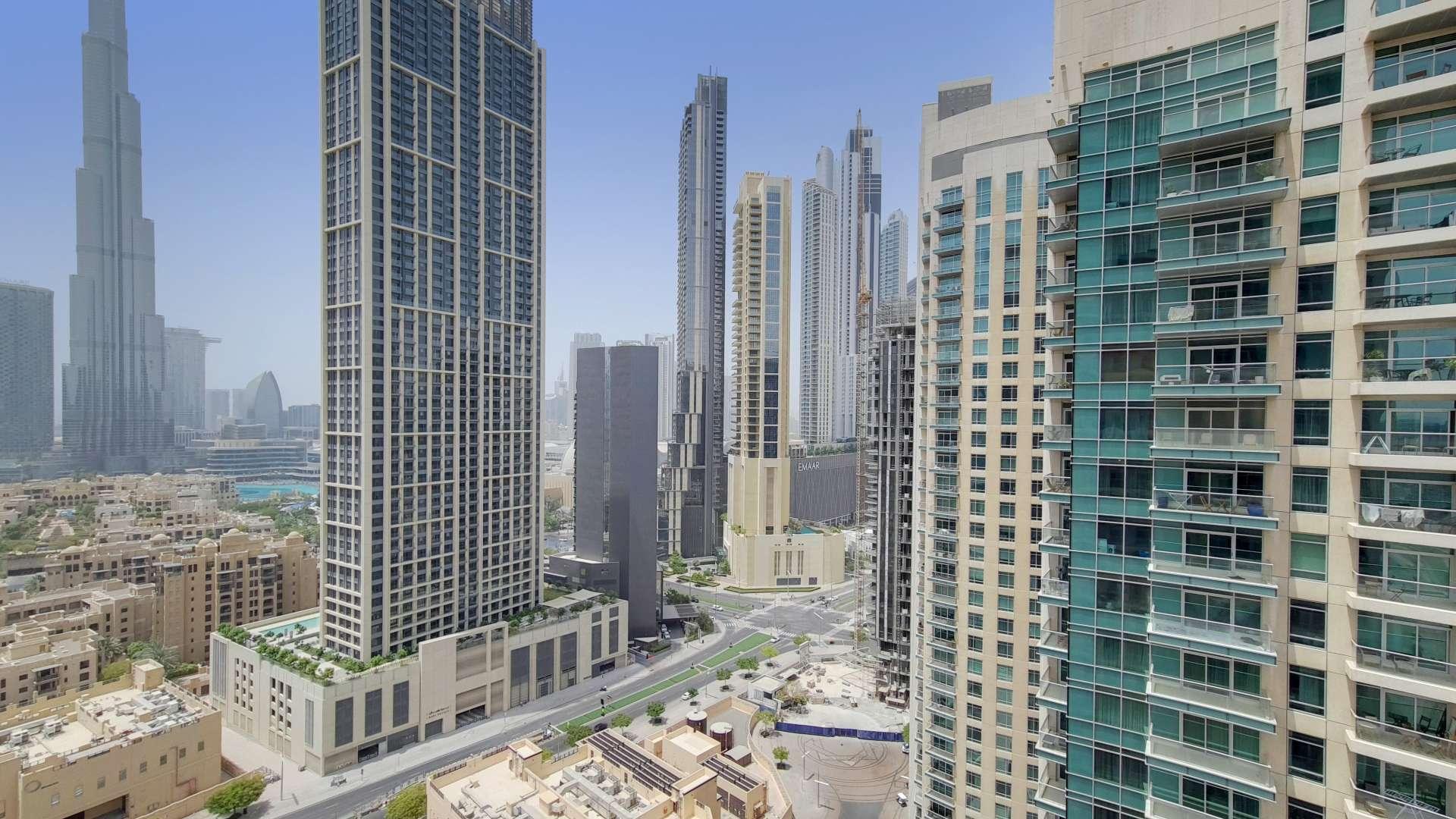 Modern living room with city views in 2-bedroom apartment, Burj Views Tower A, Downtown Dubai