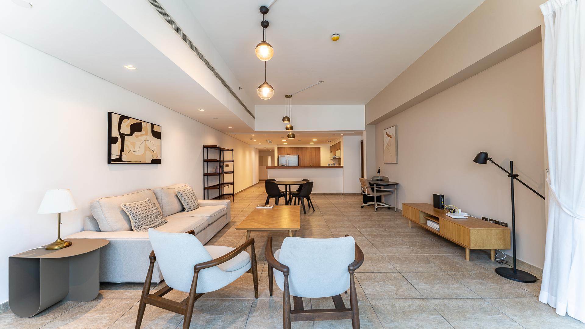 Modern living room in Palm Jumeirah apartment, Marina Residences, open layout with stylish decor