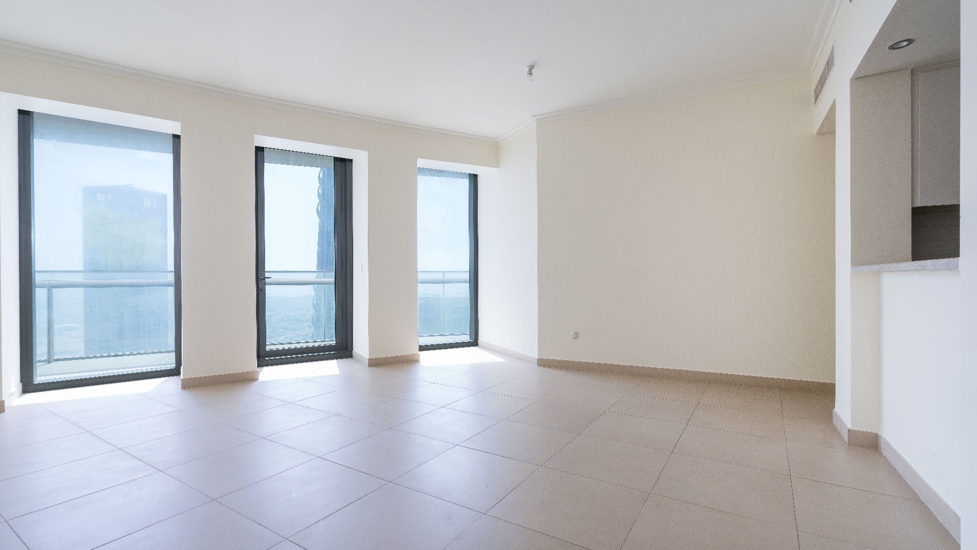 Unfurnished living room in 2-bedroom apartment, Burj Vista, Downtown Dubai, with large windows