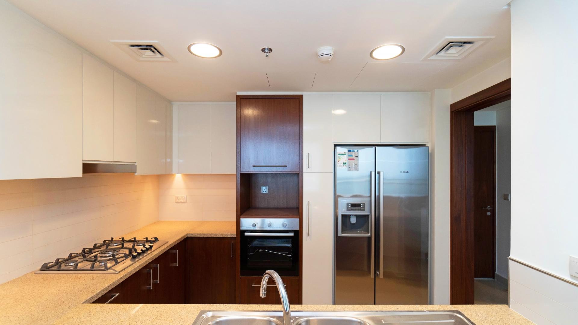 Modern bathroom with double sinks in Burj Vista apartment, Downtown Dubai