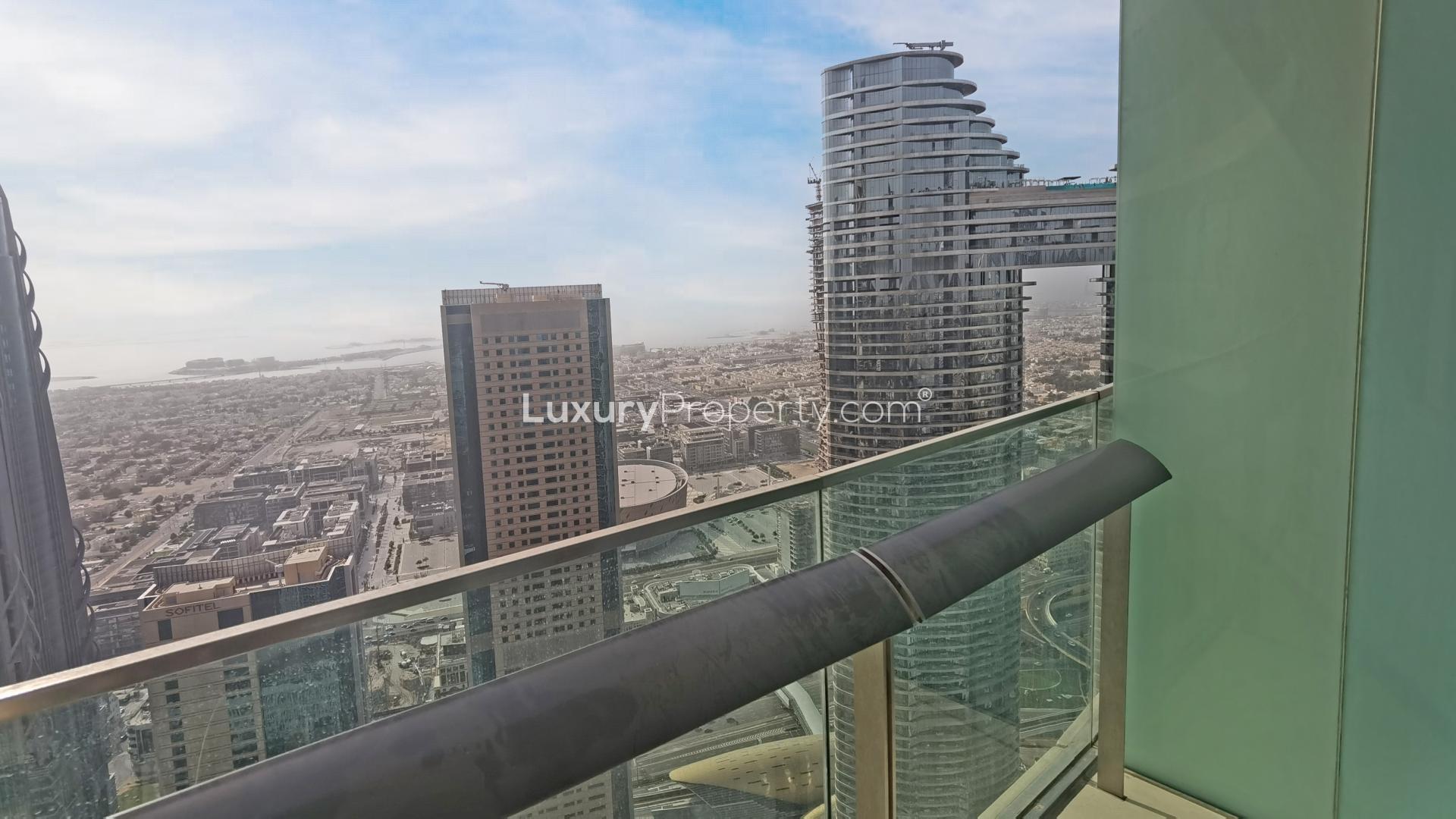 Interior view of Burj Vista apartment with cityscape through large windows, Downtown Dubai