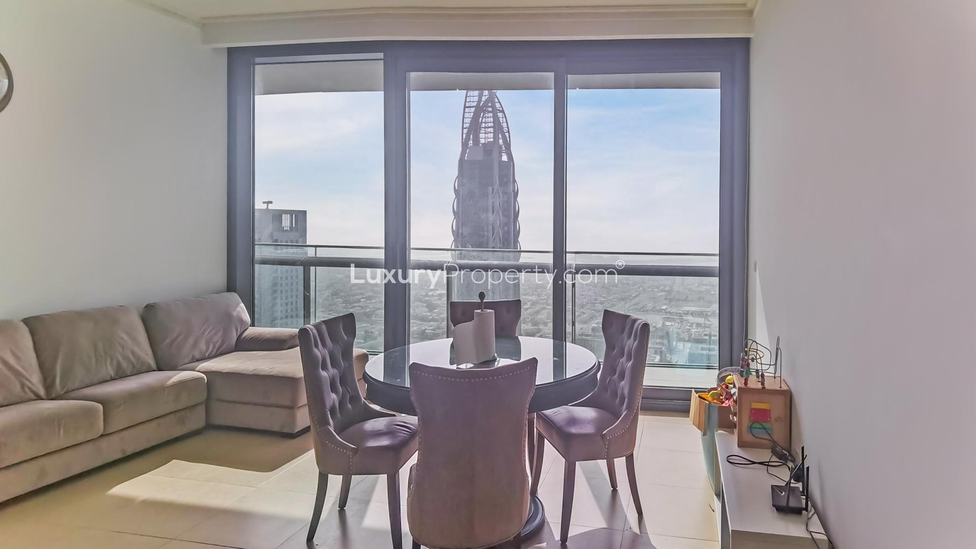 Living room with city view in 2-bedroom Burj Vista apartment, Downtown Dubai