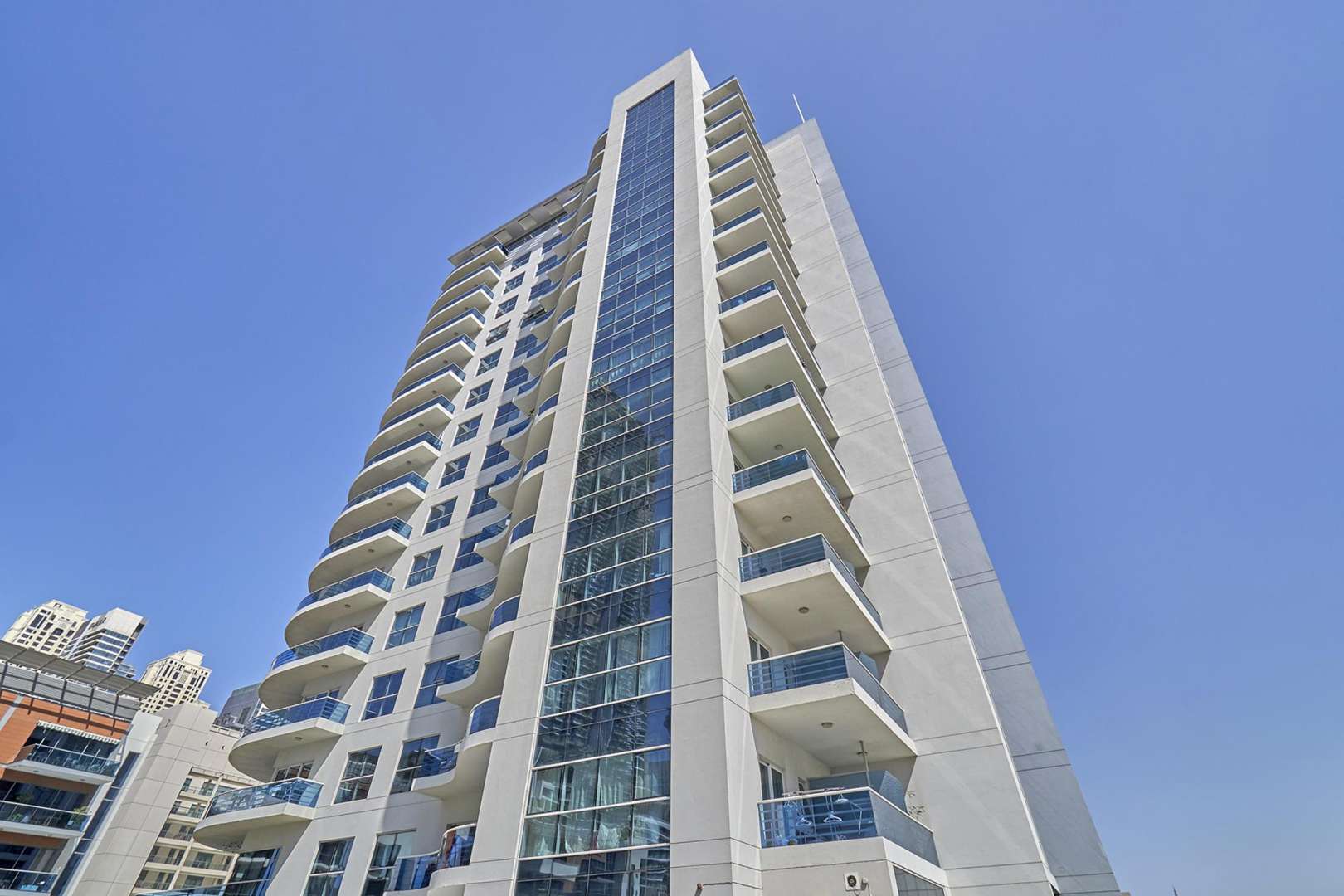 Rooftop pool view from Cascades Tower apartment, Dubai Marina skyline in background