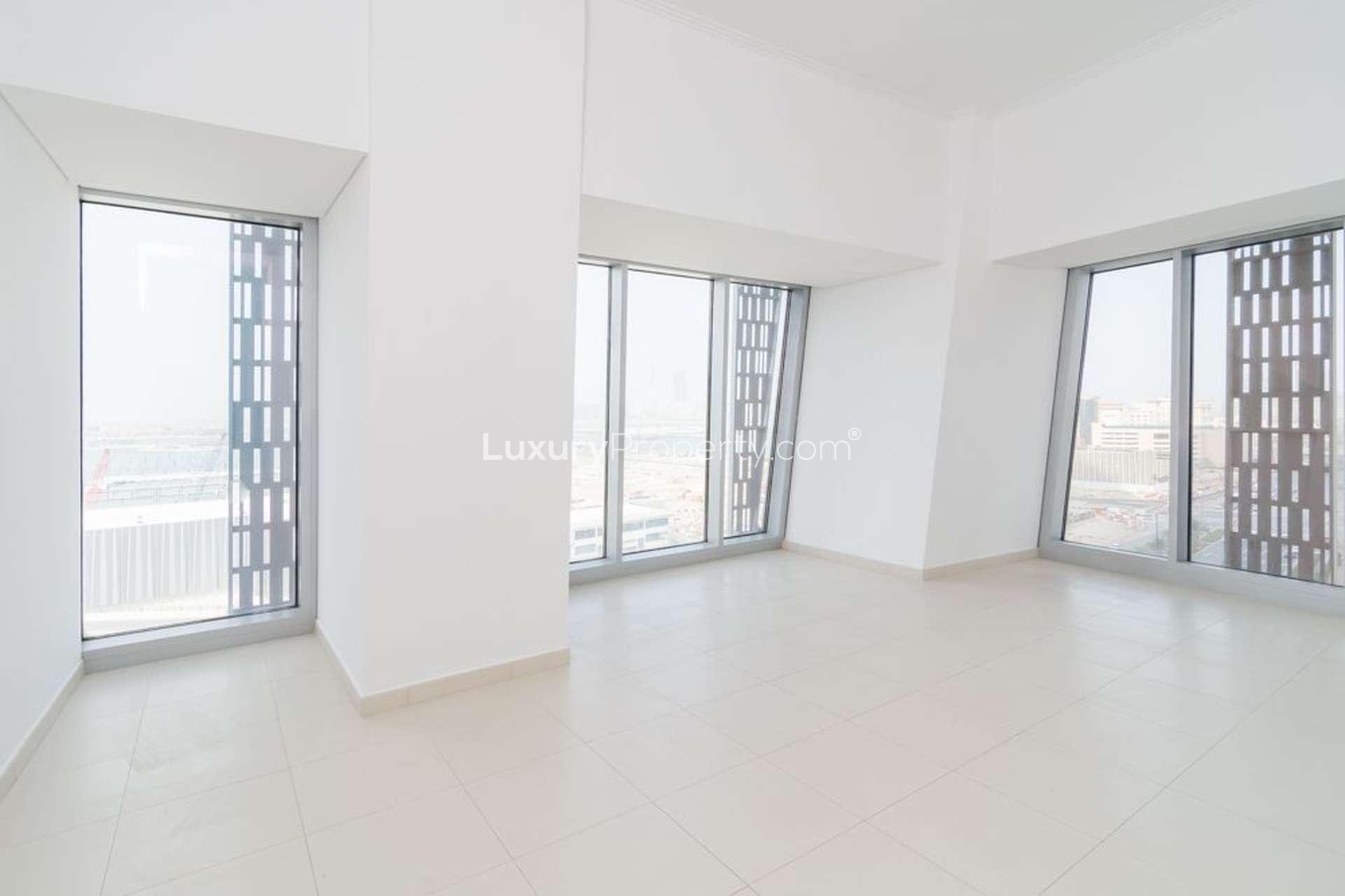 Empty bedroom with built-in wardrobe in high-floor Cayan Tower apartment, Dubai Marina