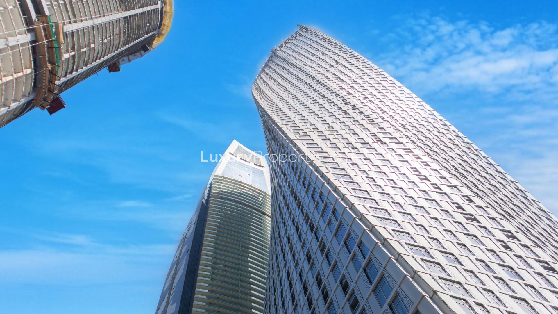 Empty living room with large windows and sea view in Cayan Tower, Dubai Marina apartment