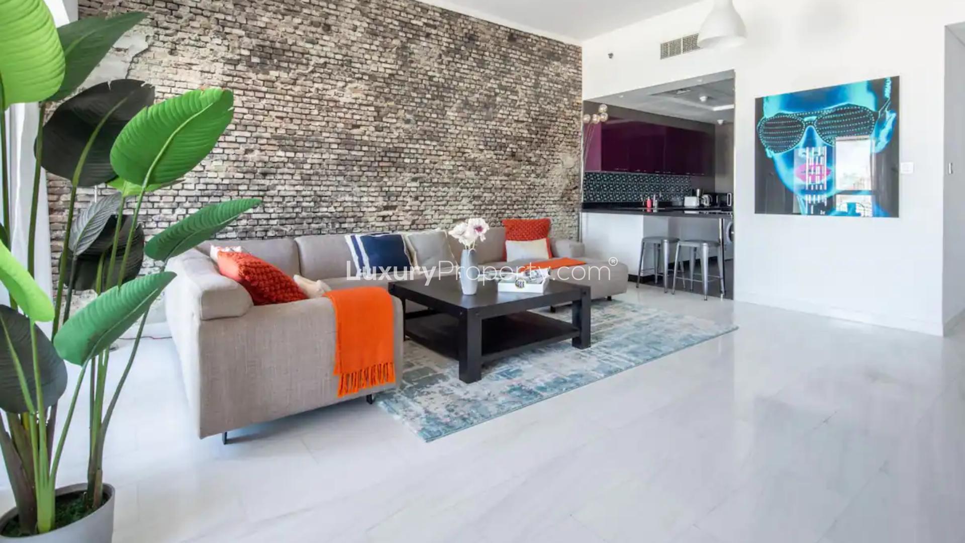 Luxurious living room in Cayan Tower apartment, featuring modern decor and comfortable seating
