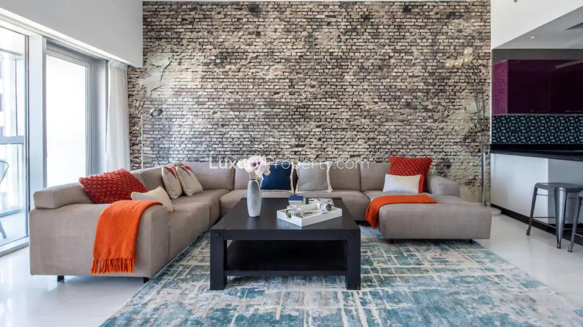 Luxurious living room in Cayan Tower apartment, Dubai Marina, with stylish decor and marina views