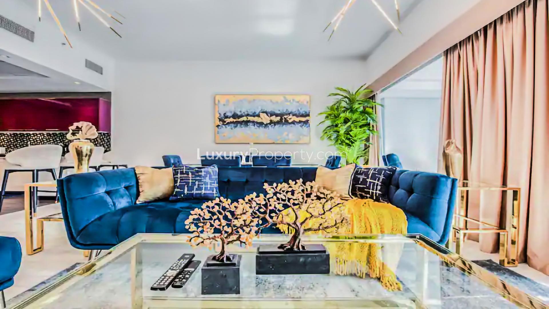 Luxurious living room in 2-bedroom apartment, Cayan Tower, Dubai Marina, with marina views