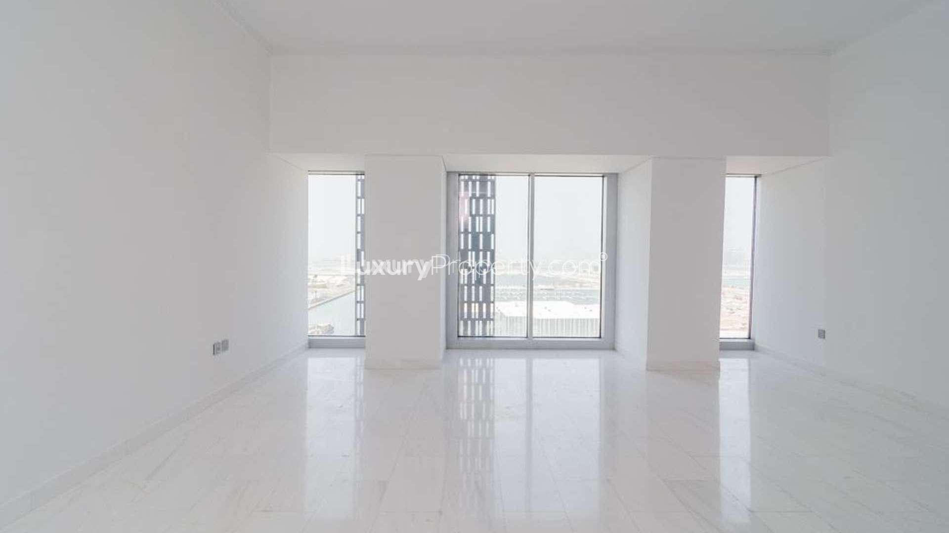 View of Dubai Marina's Cayan Tower with yachts and waterfront, apartment for rent