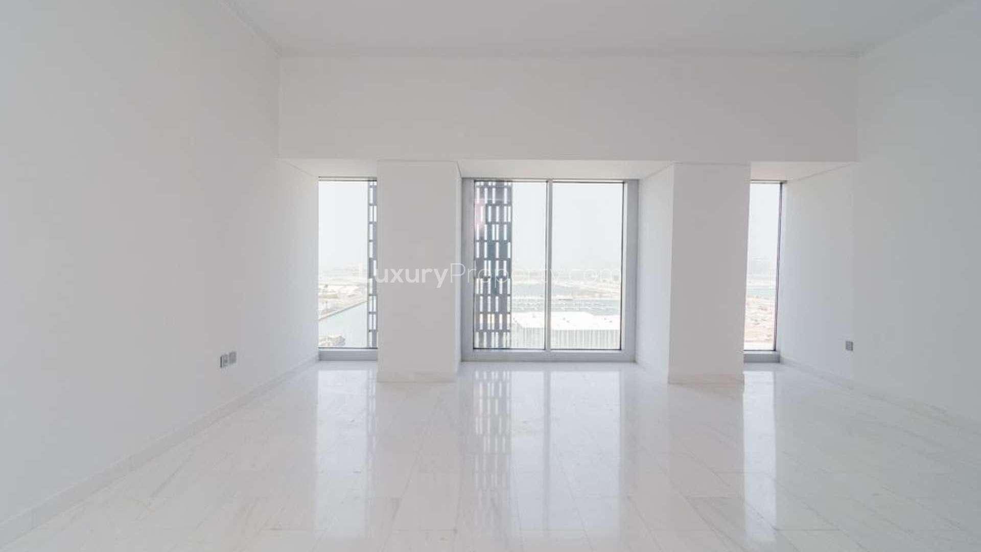 View of Dubai Marina's Cayan Tower with yachts and waterfront, apartment for rent