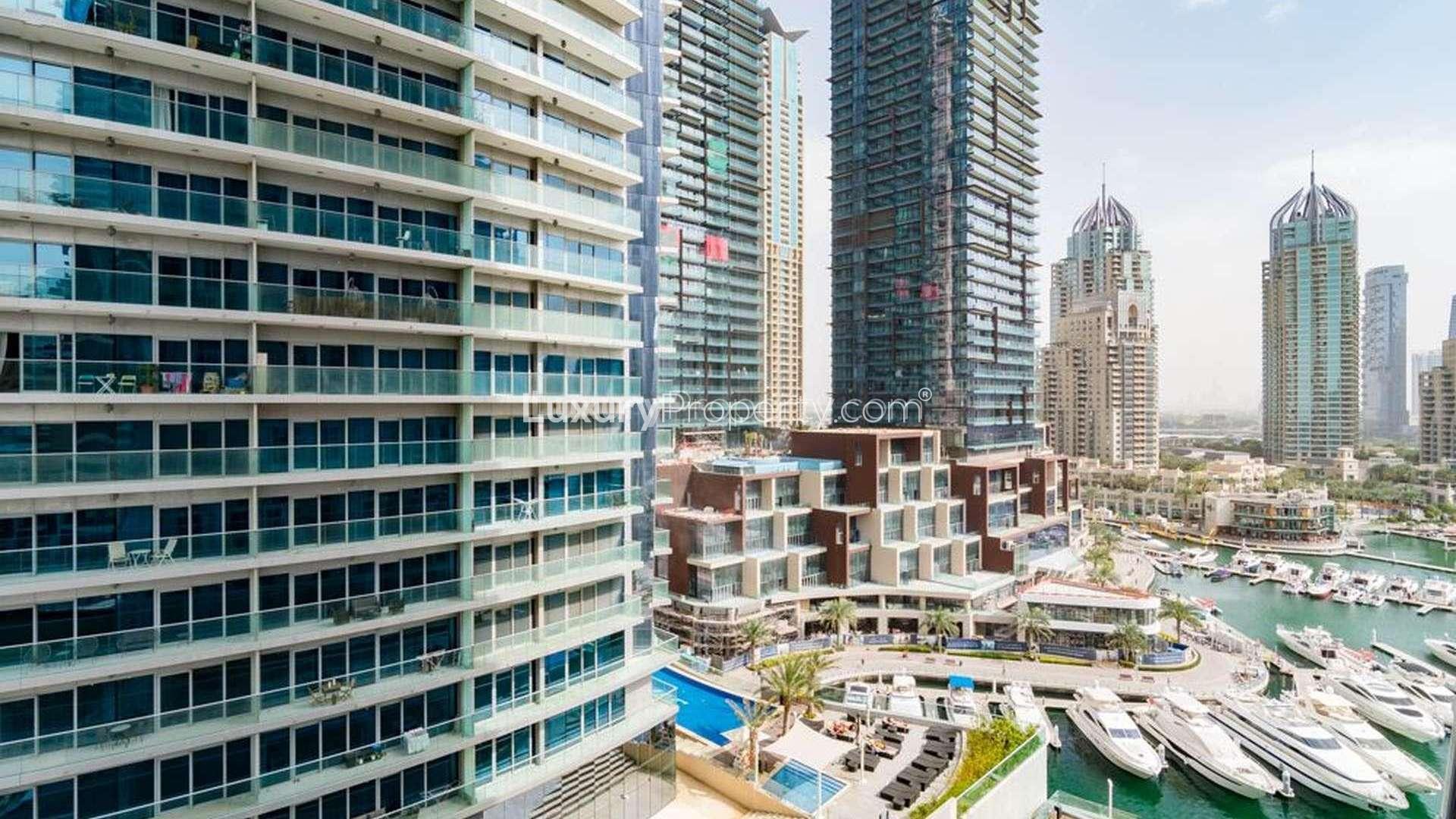 Bright living area with large windows in 2-bedroom apartment, Cayan Tower, Dubai Marina