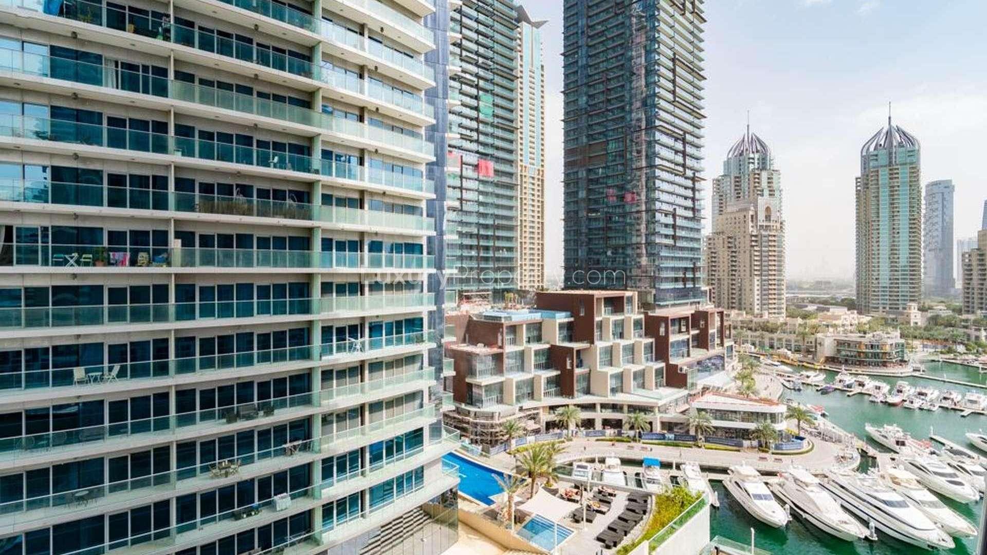 Bright living area with large windows in 2-bedroom apartment, Cayan Tower, Dubai Marina
