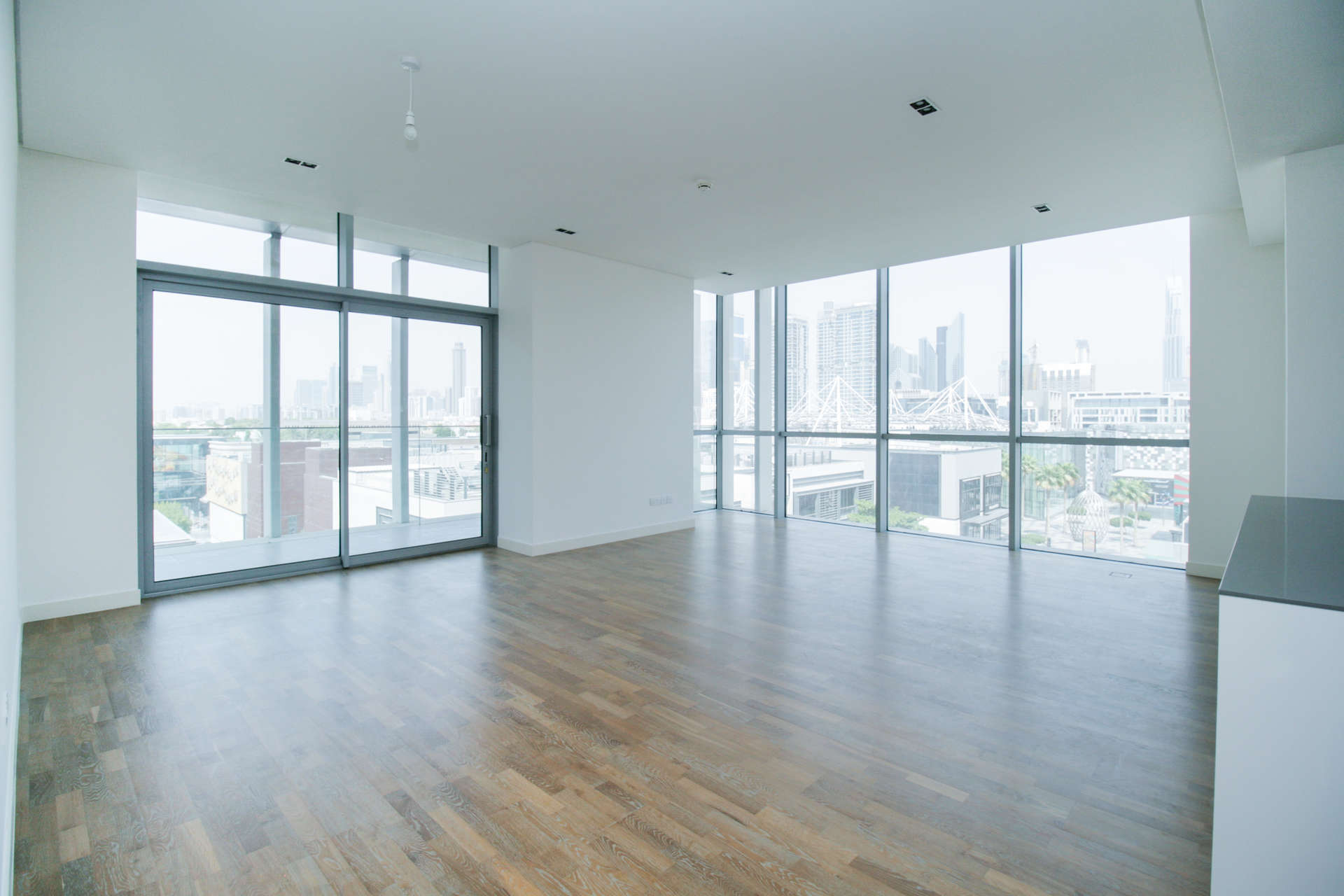 Contemporary open-plan kitchen and living area in City Walk apartment, Dubai, with skyline views