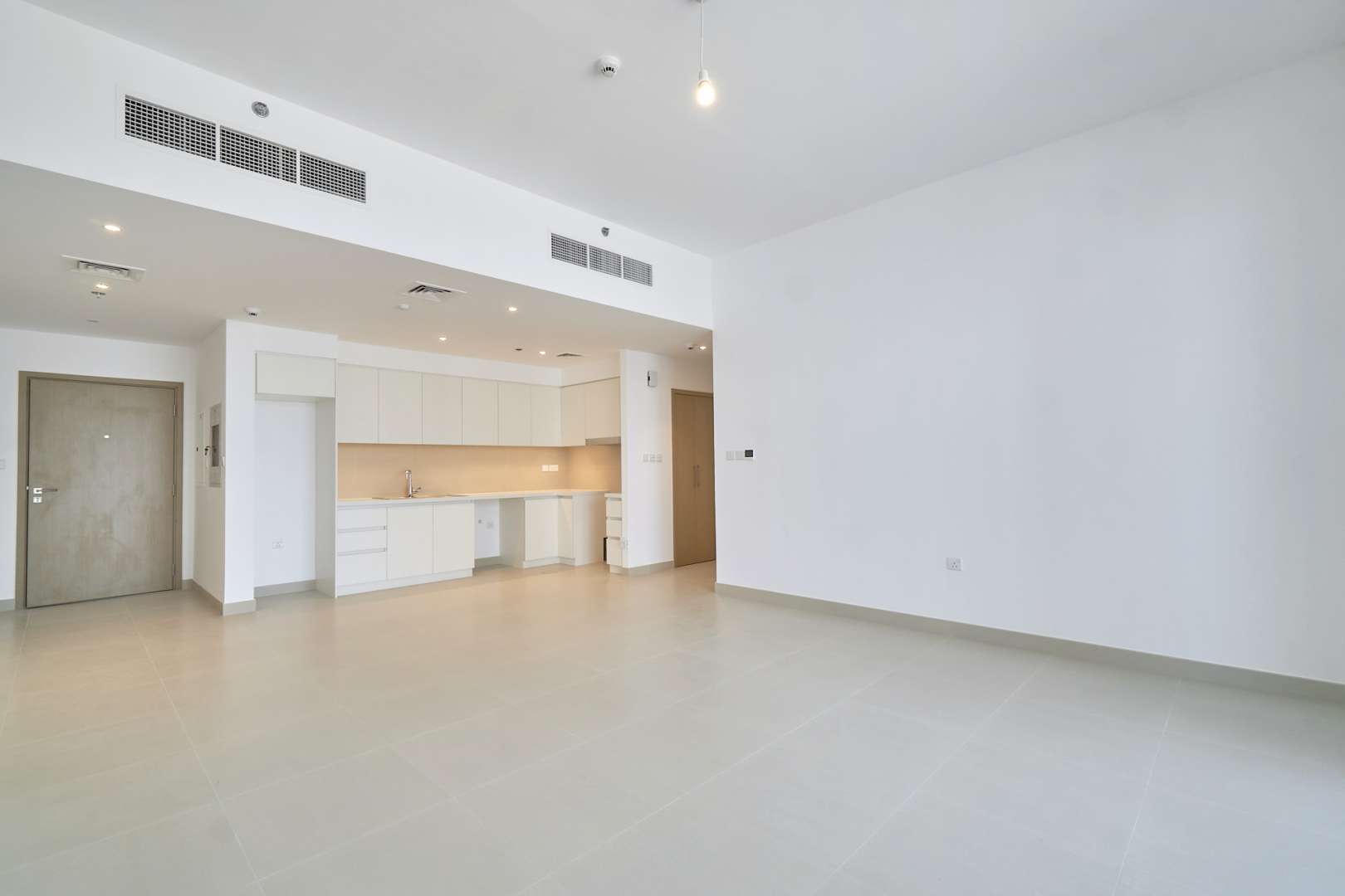 Outdoor pool at Creek Horizon, Dubai Creek Harbour, surrounded by modern high-rise apartments