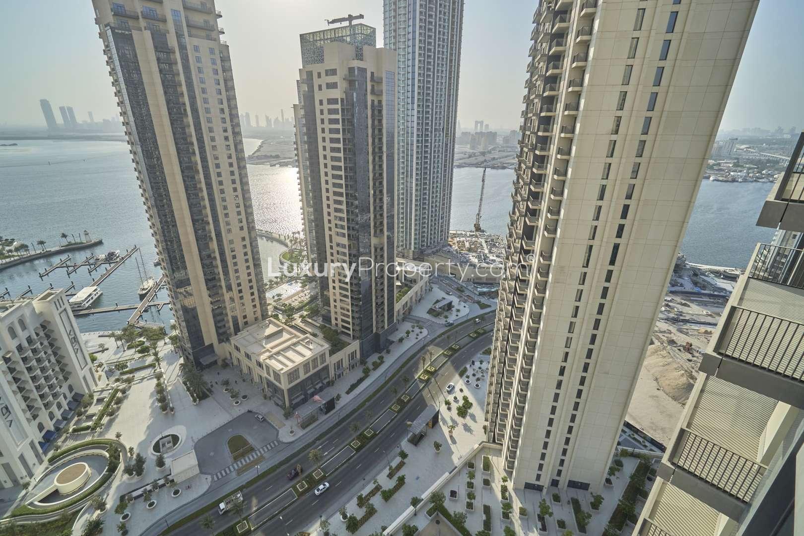 Aerial view of Dubai Creek Harbour skyscrapers with marina and water views at Creek Horizon