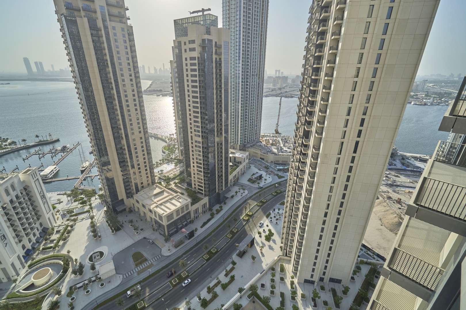 Aerial view of Dubai Creek Harbour skyscrapers with marina and water views at Creek Horizon