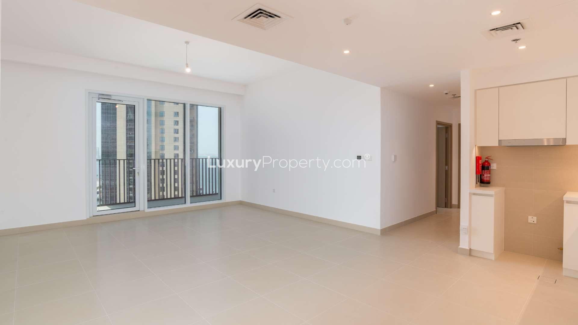 Modern kitchen and living area in 2-bedroom apartment, Creek Horizon, Dubai Creek Harbour