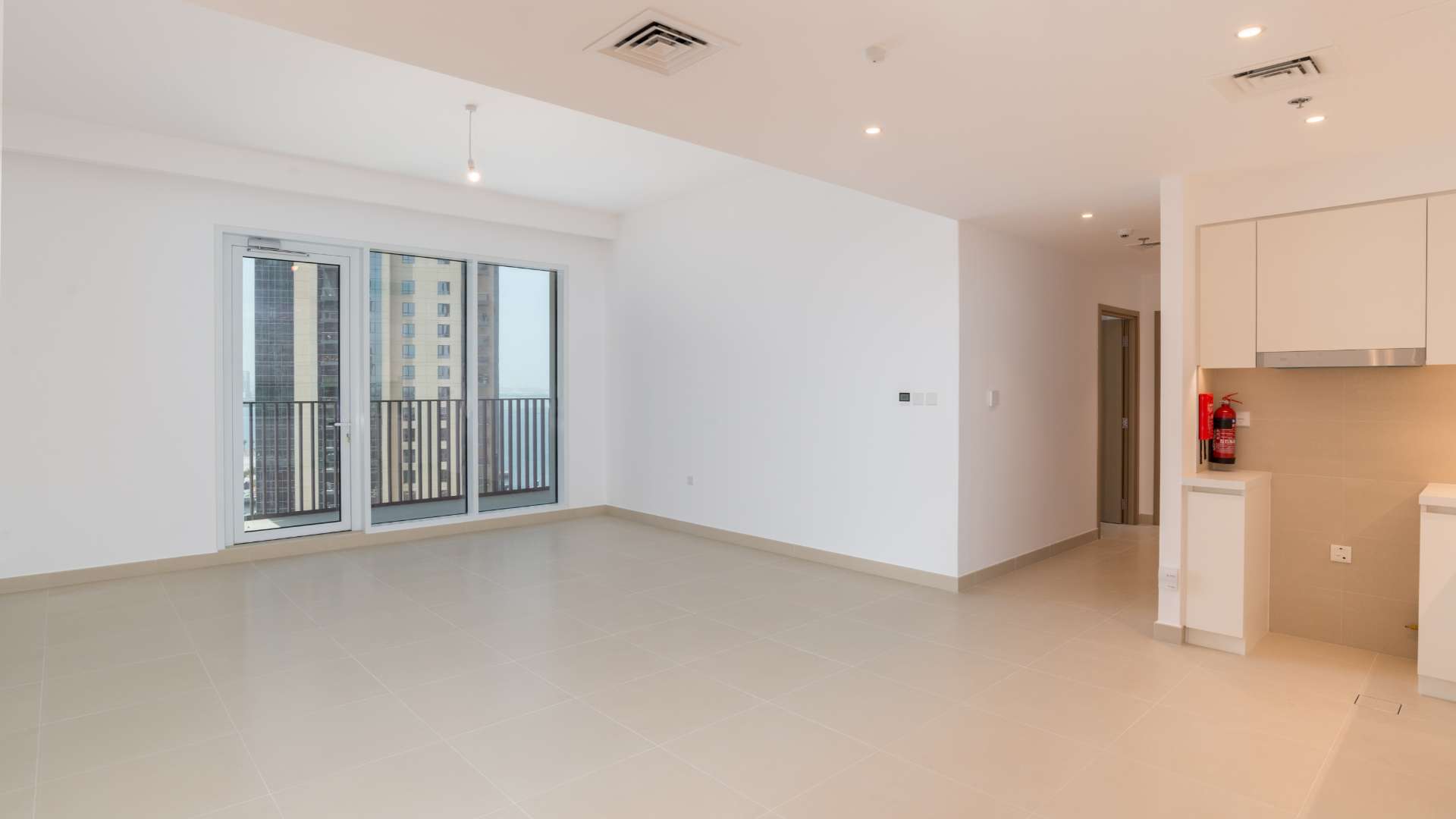 Modern kitchen and living area in 2-bedroom apartment, Creek Horizon, Dubai Creek Harbour