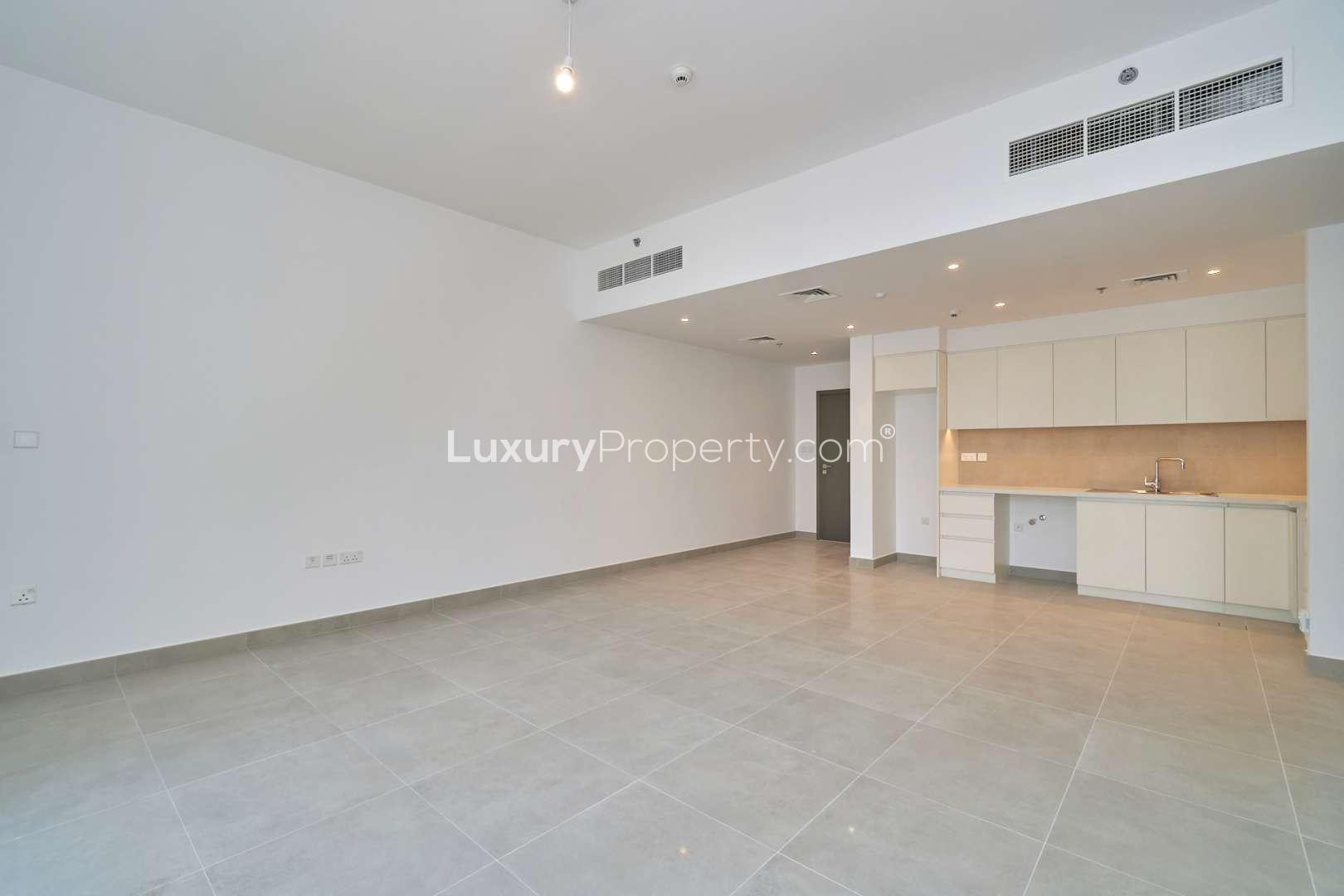 Bright living area in Creek Horizon apartment, large windows with city views, Dubai Creek Harbour