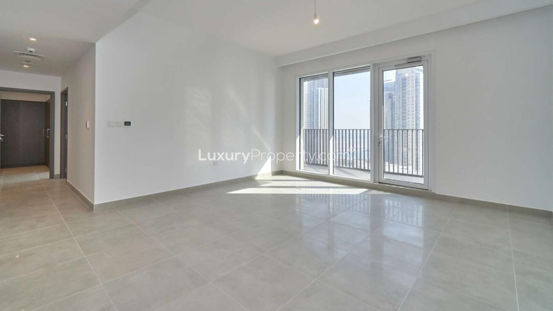 High-floor apartment living room with large windows in Creek Horizon, Dubai Creek Harbour